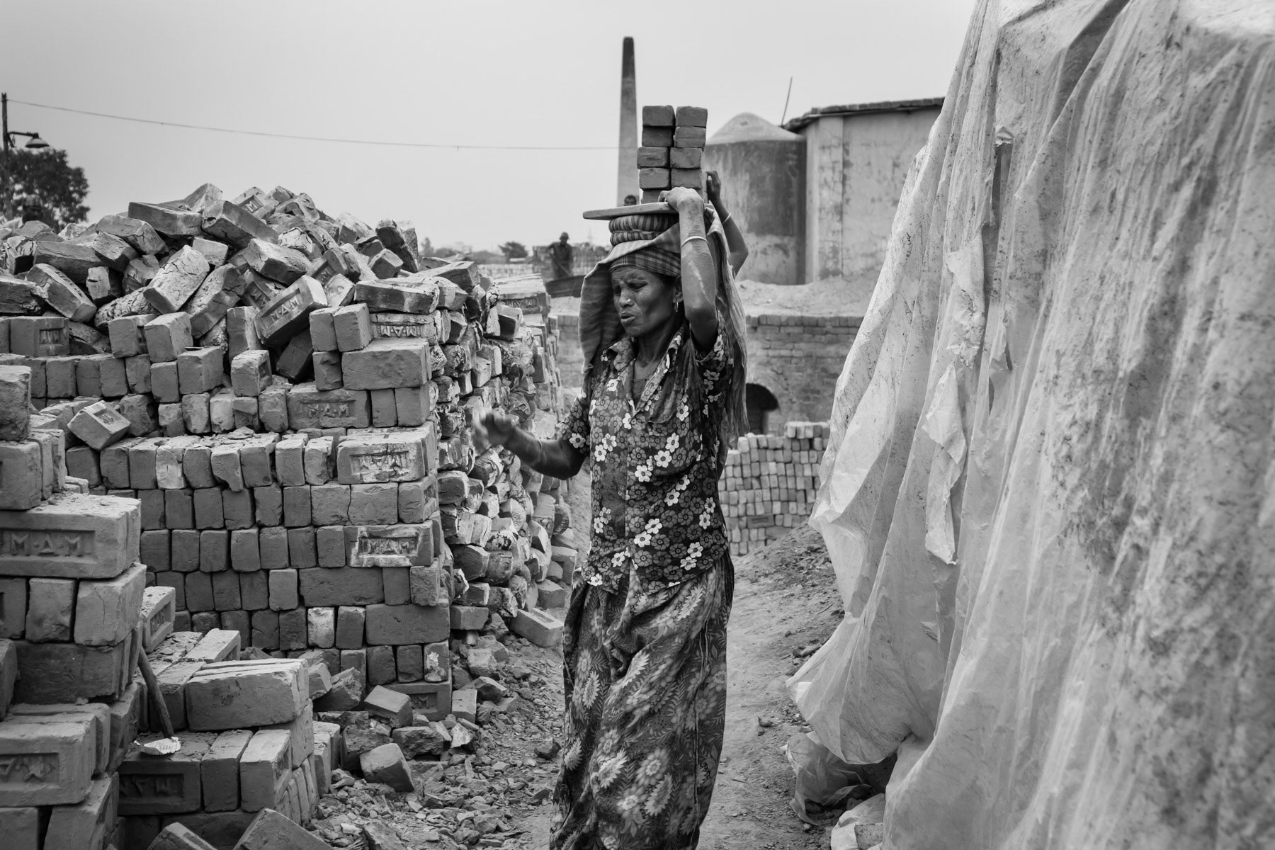 Hard Labour is not reserved for men only, high numbers of women end up working on the brick fields and carry extremely heavy loads resulting frequently in severe spinal cord injuries. Mymensingh brick kilns, Bangladesh, May 2015