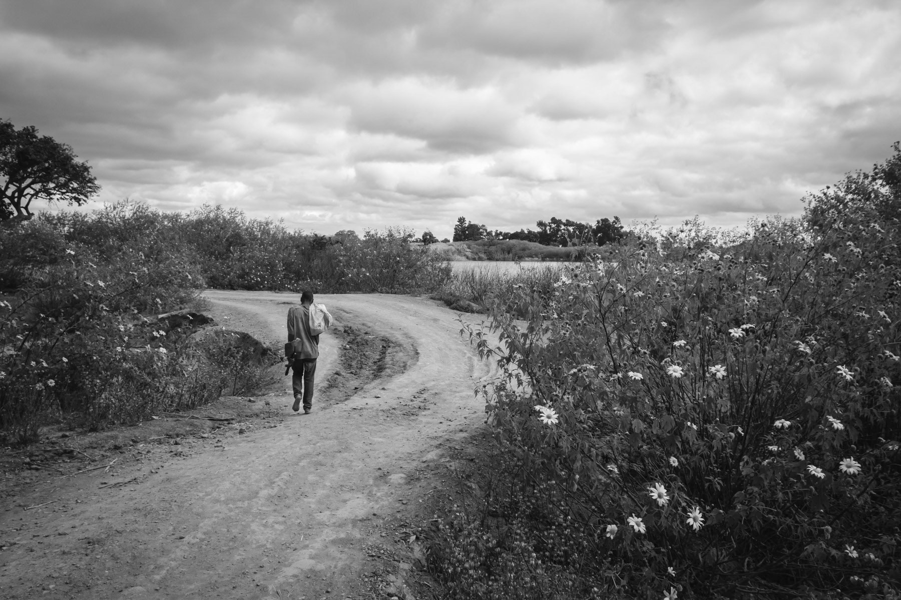 Miner going to work in a small scale mining operation that have flourished since the closure of the main mine operations in 1994. Kabwe, Zambia, May 2021