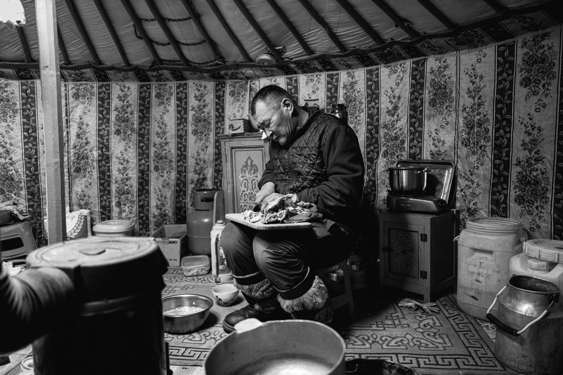 A herder performing daily chores inside the Ger, a space of centuries-old tradition. Gobi desert, Mongolia, December 2025