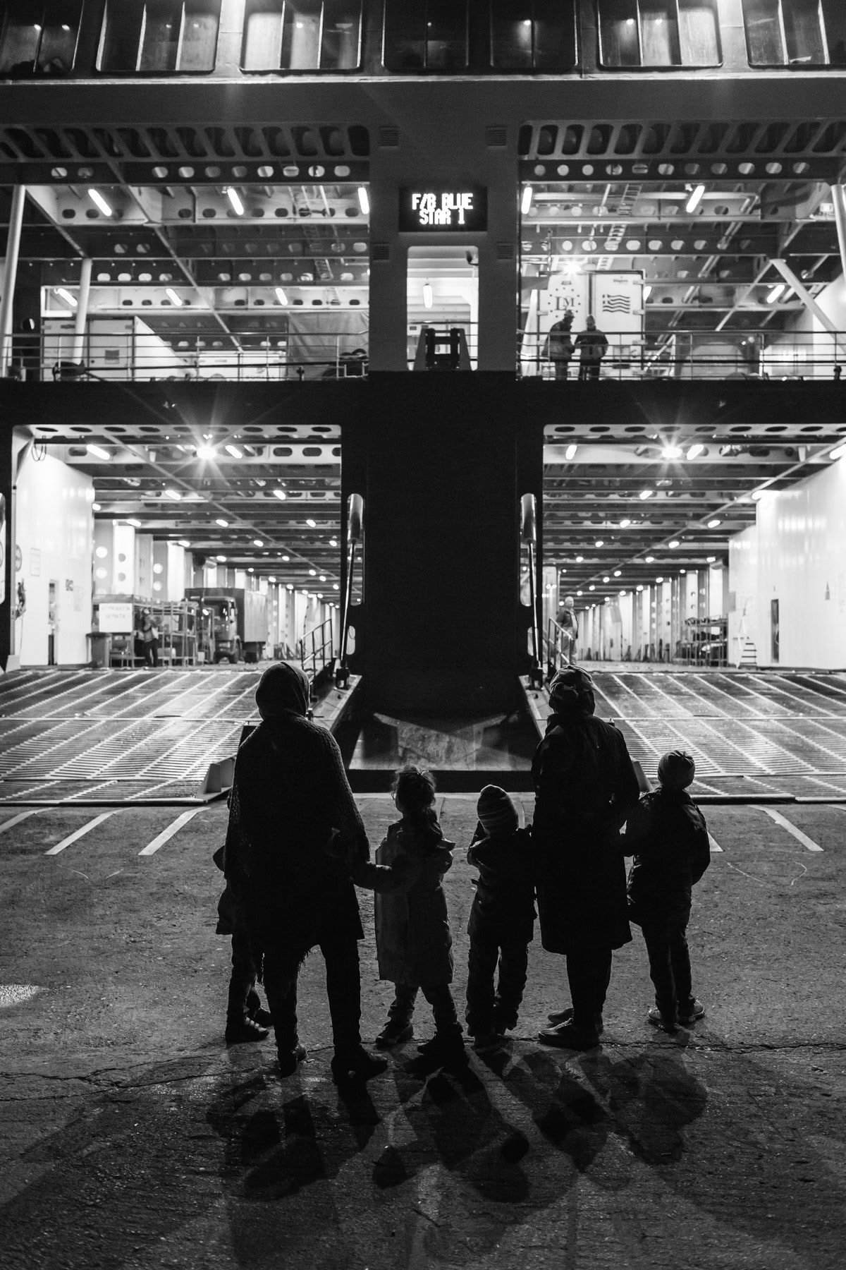 Refugees waiting to embark. Ferry for Athens, Levbos port, Greece, November 2015