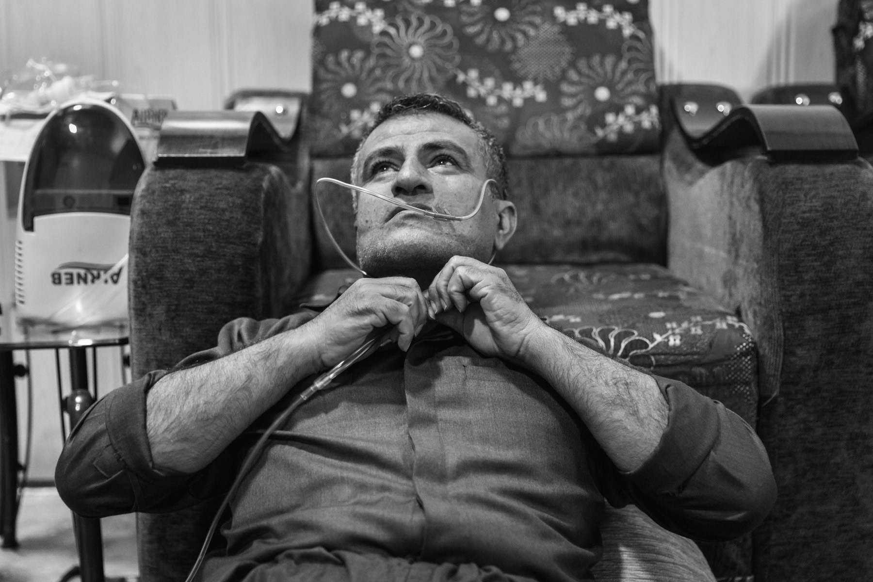Kamal, 47 years, is a victim of the Halabja chemical attack in 1988. He has life threatening respiratory problems requiring him to be at least 16 hours per day connected to an oxygen dispenser. He has been on daily oxygen for the past 10 years, before that occasionally at the hospital. He spends an average of 90 usd on various drugs and can't leave his home or be separated of the oxygen dispenser for more than a couple of hours. Before his condition got worse, he used to have an office job at the municipality. Halabja, Kurdistan, Iraq, August 2018