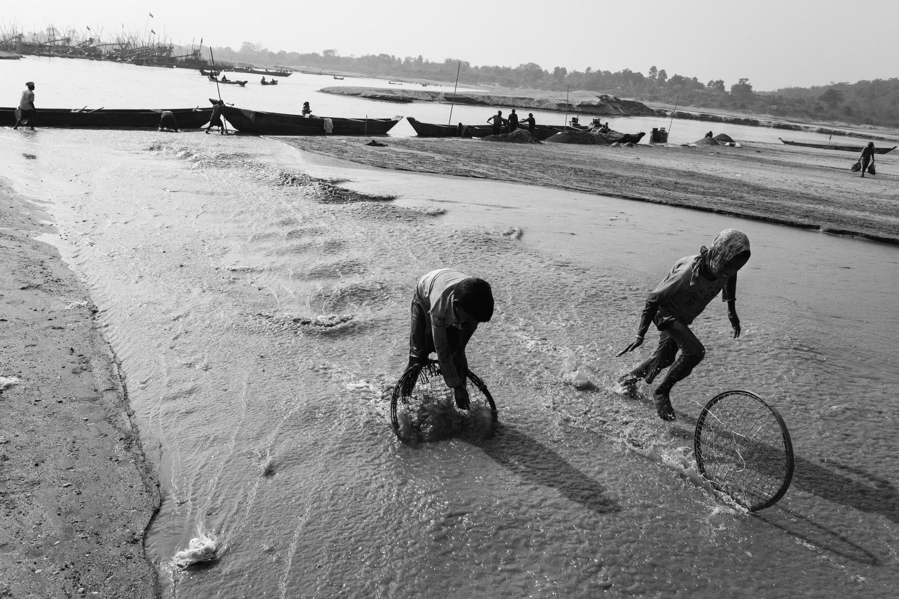 Children collecting stones in the Dholai river bed, Bholaganj in Bangladesh, December 2015
