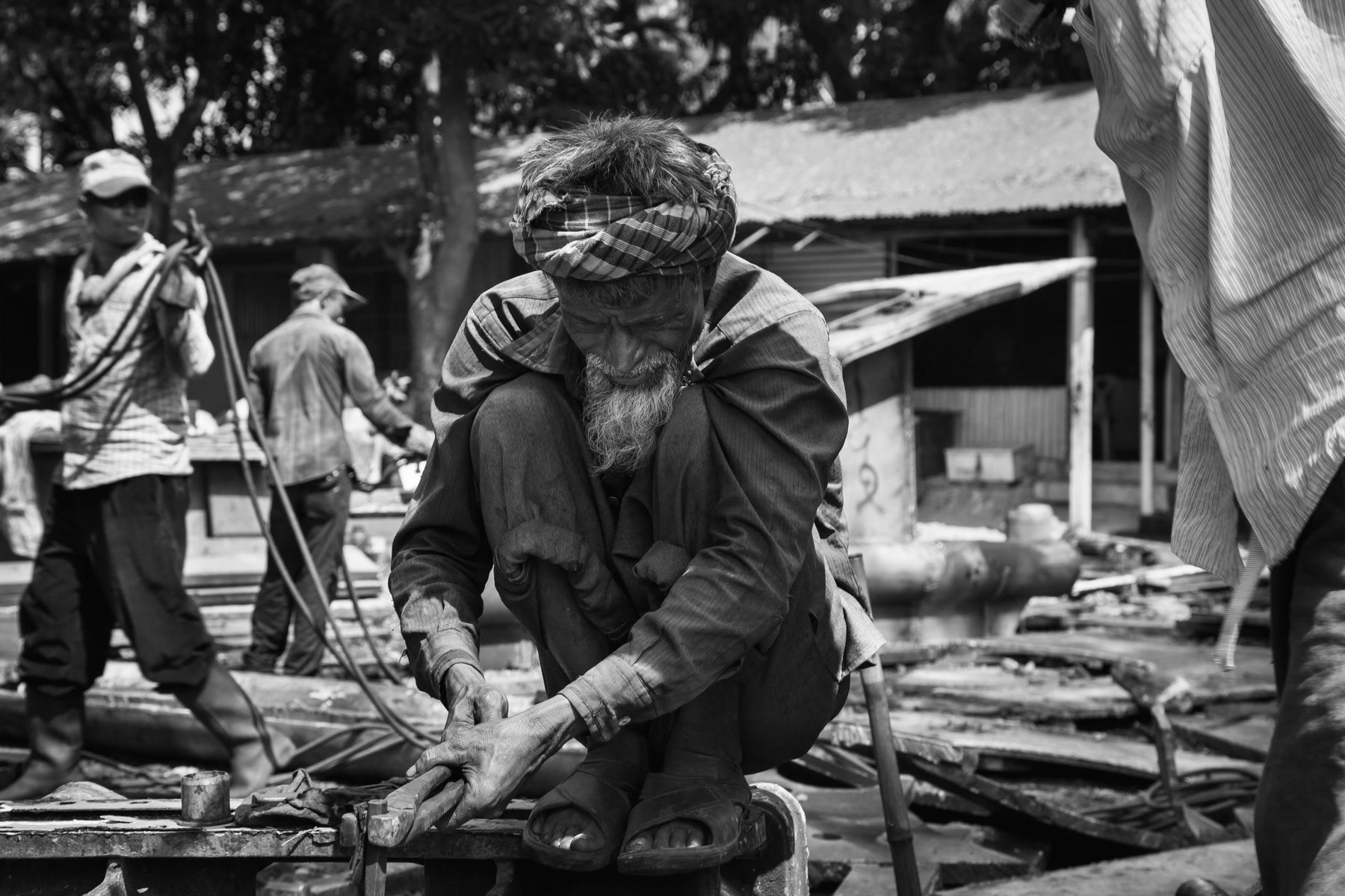 Ship breaking yard workers taking manually to pieces boat parts, Bhatiary ship breaking yards, Bangladesh, October 2014
