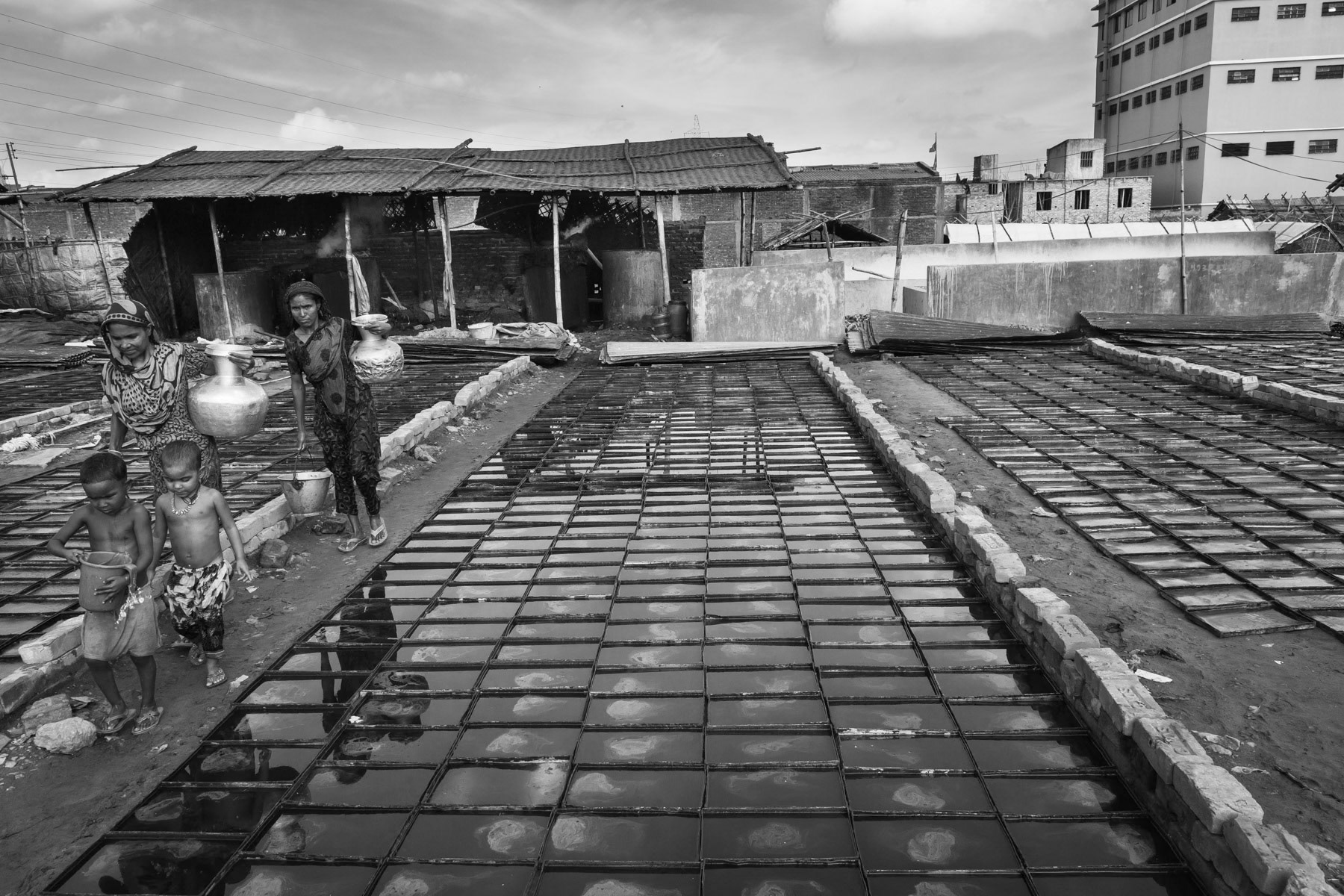 Glue production plant, scraps of leather are boiled and the residual liquid sun-dryed. Hazaribagh, Bangladesh, October 2014