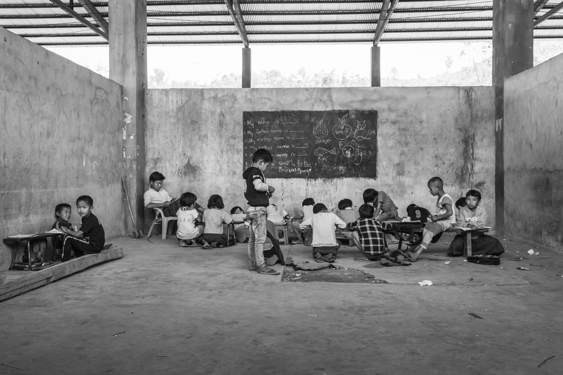 Summer class for Kachin children displaced by the ongoing conflict between the Myanmar military forces and the Kachin Independence Army (KIA). Pa Kahtawang IDP camp in KIA controlled territory, Mai Ja Yang, Kachin, Myanmar, April 2019