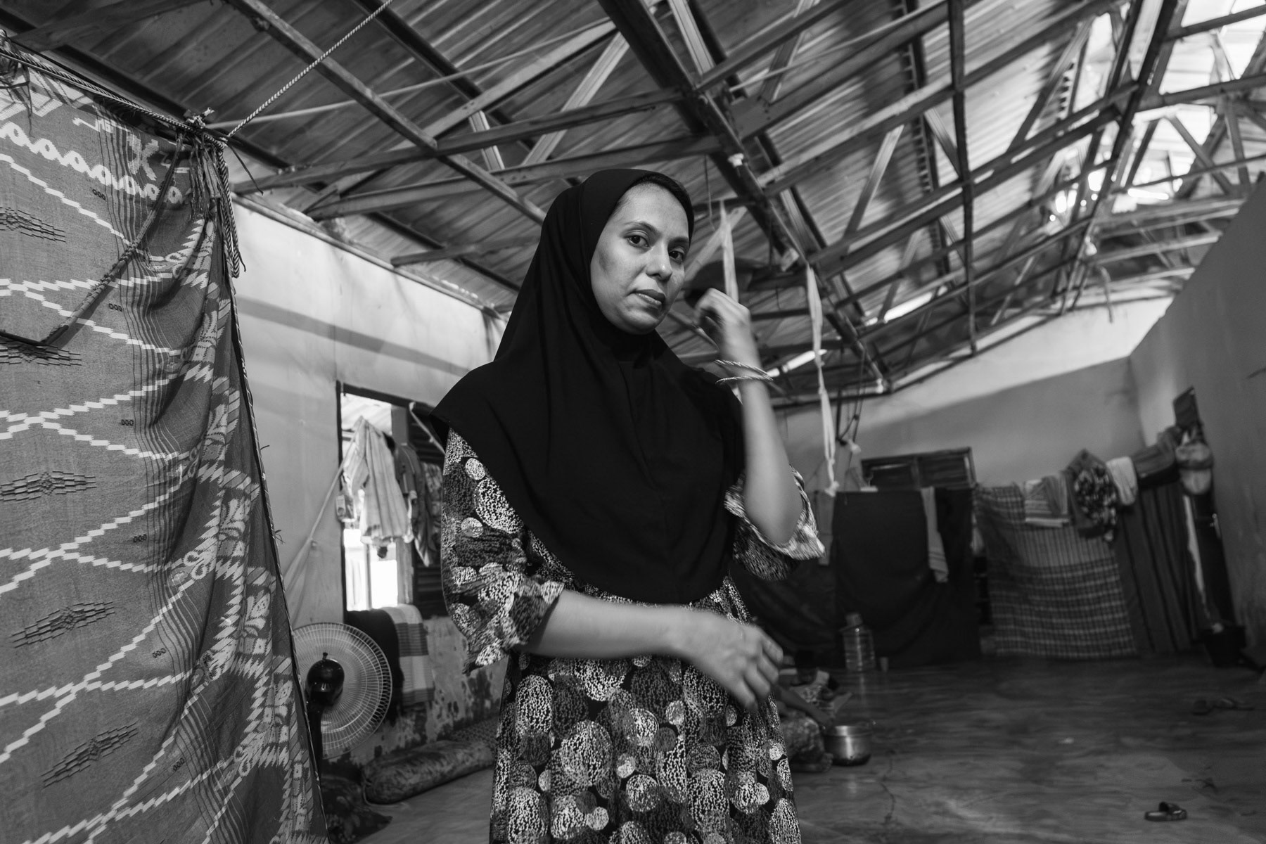 A woman from the Myanmar Rohingya minority who was trafficked out of Sittwe the capital of Rakhine in August 2023 overland via Thailand until Malaysia from where she crossed into Sumatra by sea. More and more Rohingya have the desire to reach Aceh rather than Malaysia because they feel safer and believe they can be resettled in a third country faster than from Malaysia. Padang Tijie shelter for Rohingya refugees, Aceh, Indonesia, October 2023