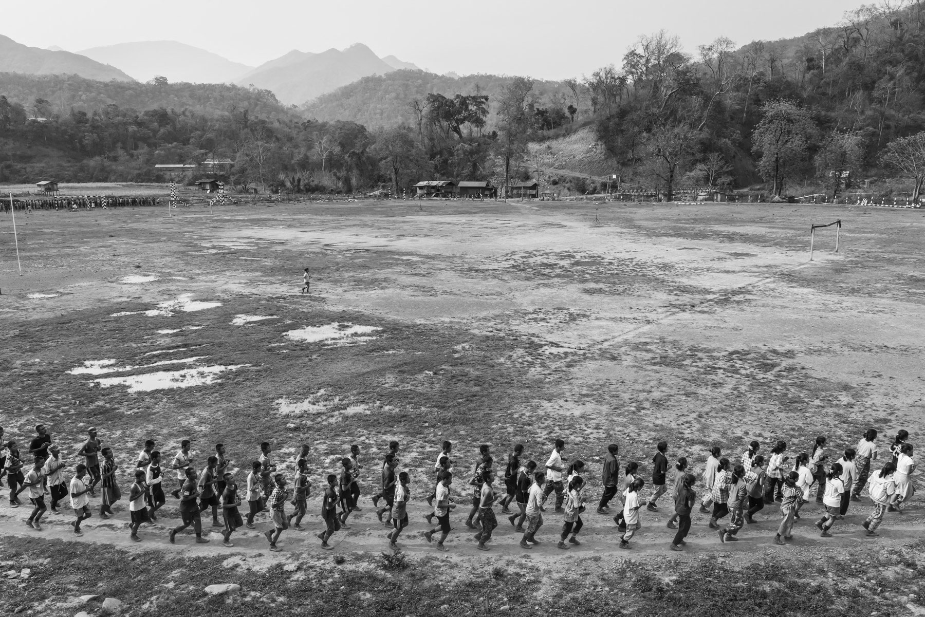 New recruits for the Chin National Army (CNA) doing physical exercises during their lenghty training before integrating the CNA. The ever increasing air strikes and forced military service enacted by the military dictatorship, has substantially increased the number of people that engage and seek refuge with the ethnic armed groups opposing the military coup leaders. CNA HQ, Camp Victoria in Chin State, Myanmar, April 2024
