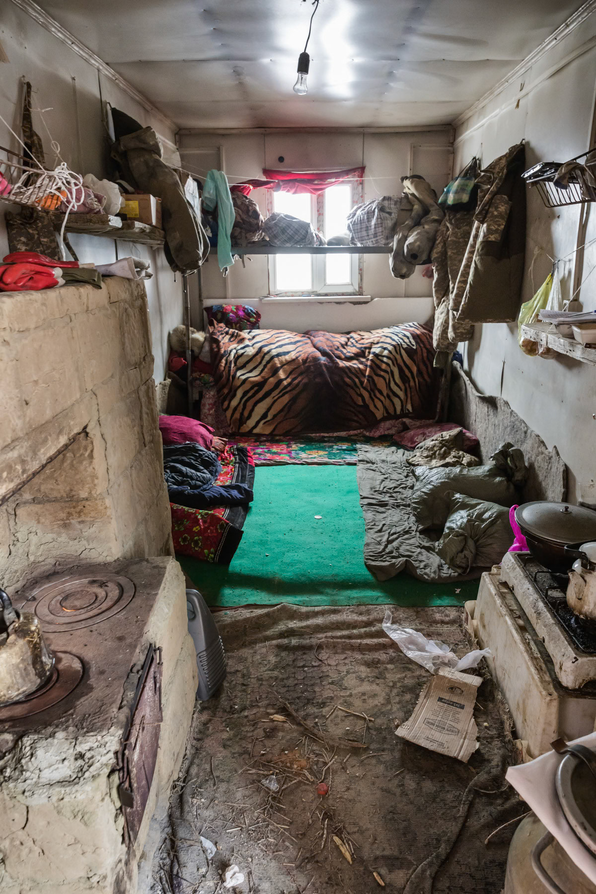 A fishermen base camp on the Aral Sea. Fishermen from surrounding villages and further away would come here and stay for about 3 months to do ice fishing on the Sea. Interior of a living space in one of the containers. Kazakhstan, January 2019