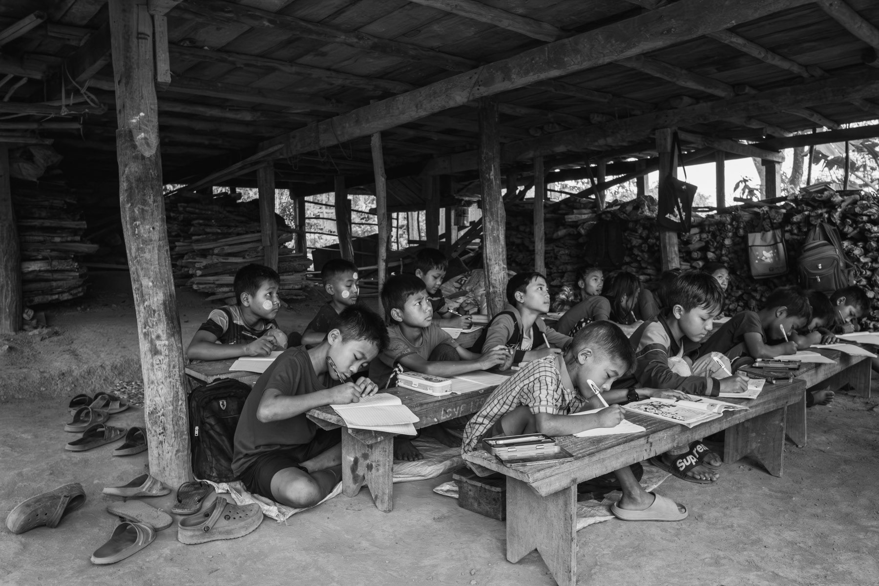 School classes held under random houses for fear that schools would be targetted by airstrikes as has been the case repeatedly throughout Myanmar and Chin State. Leilet village in Falam township, Burma, June 2023