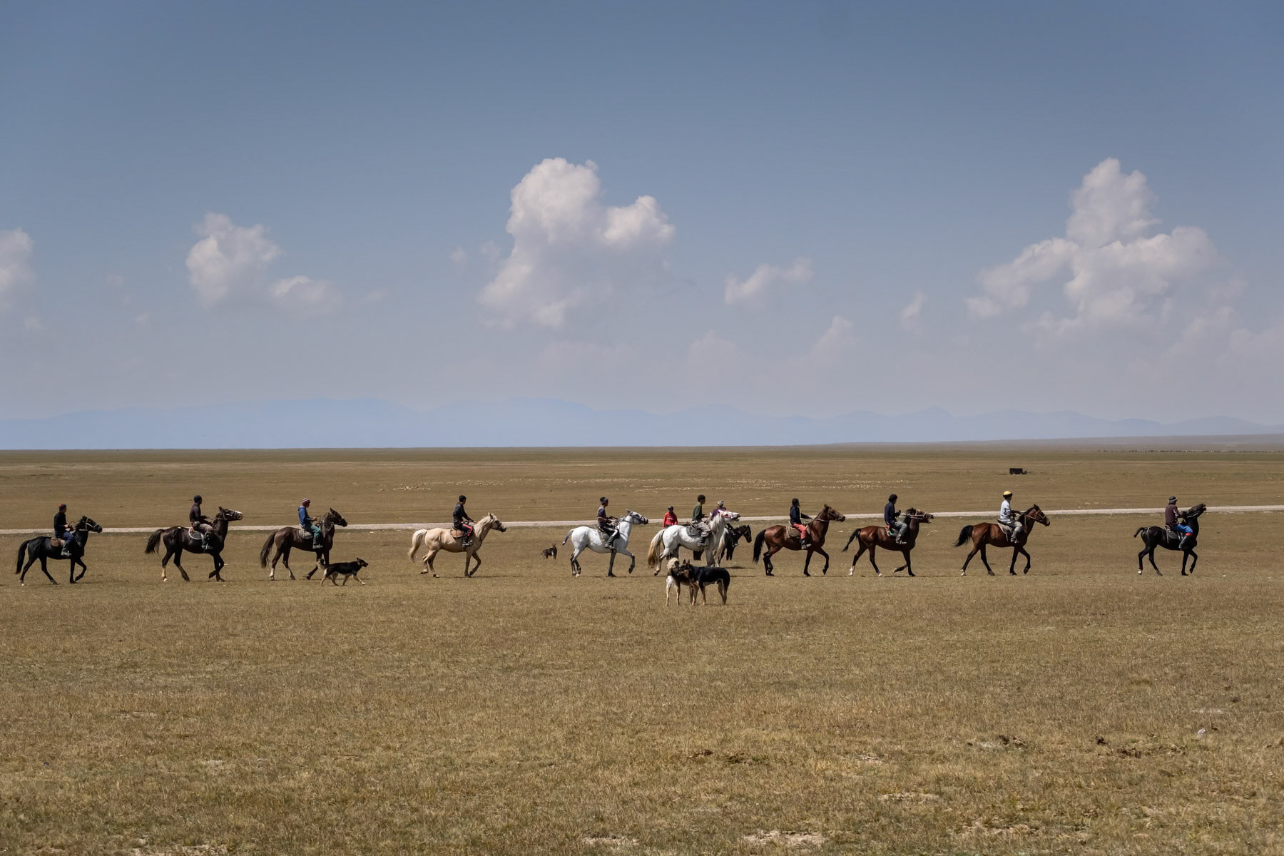 One of the teams before a traditional horseback game, Kok Boru, consisting of dropping a dead goat carcass in the opponents' goal. In Kyrgyzstan and generally Central Asia and Afghanistan it is considered a national sport and very popular. Son Kul Lake, Naryn region, Kyrgyzstan, August 2021
