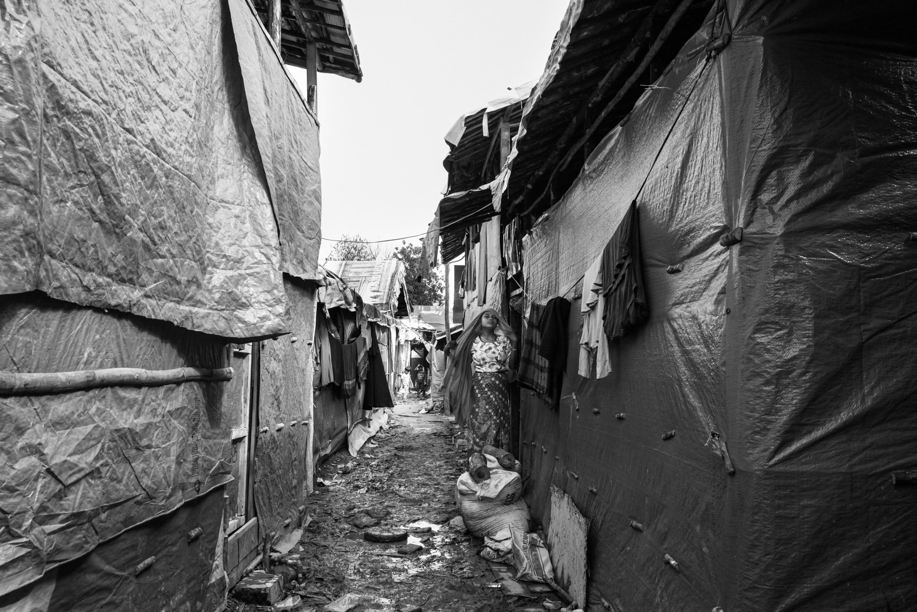 Months after a perilous boat journey, a Rohingya refugee finds a fragile home in a makeshift camp in Sumatra. Pekanbaru, Indonesia, October 2025