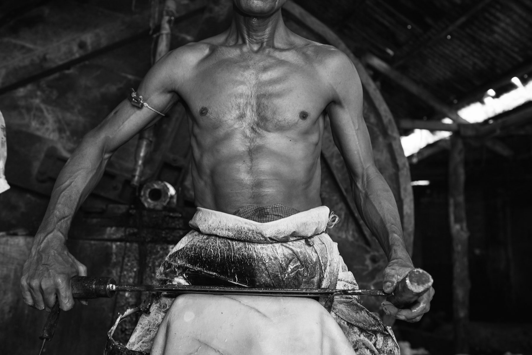 Tannery workers, sometimes children, are working day long usually unprotected exposed to heavily toxic residues while processing the skins to produce leather. The majority of the leather is exported to the U.S., E.U. and China. Removing remaining hair from the skin using a dull knife, Hazaribagh tannery, Bangladesh, October 2014