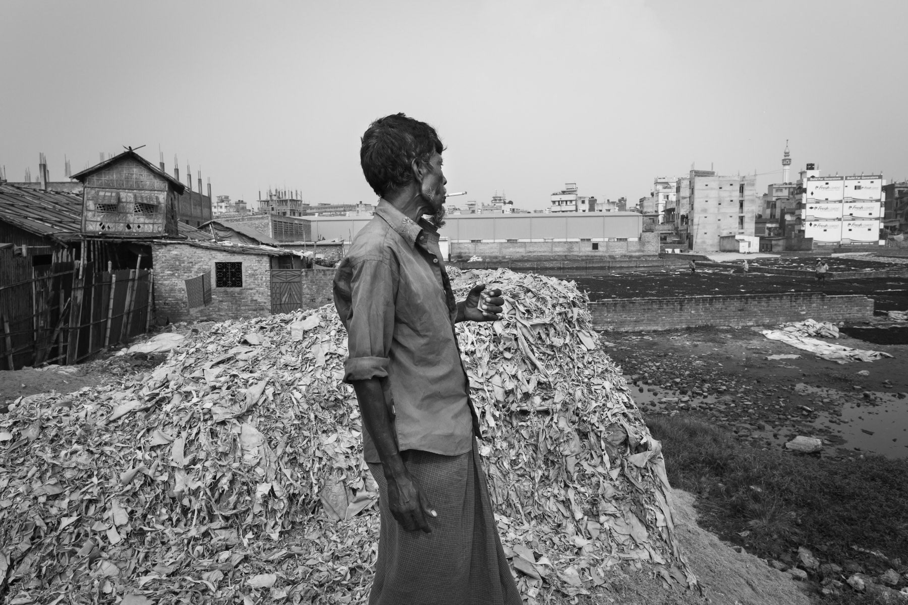 The remains of leather and toxic waste produced by the tanneries are re-used in secondary small tanneries, for glue production, chichen feed and small garments for the local market. Hazaribagh, Dhaka, October 2014