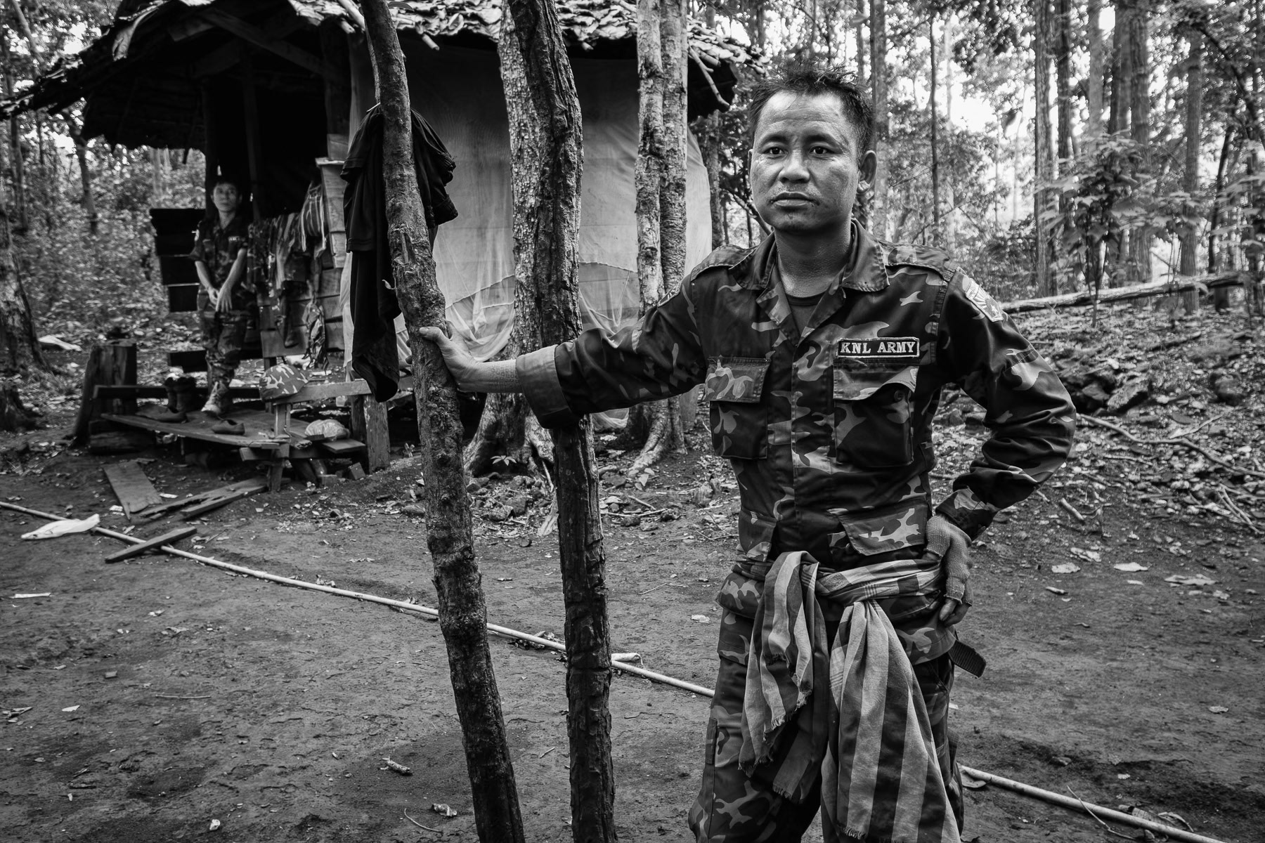 In Myanmar's Karen State, KNLA soldiers pause in June 2025, amidst intense battles for key border areas.
