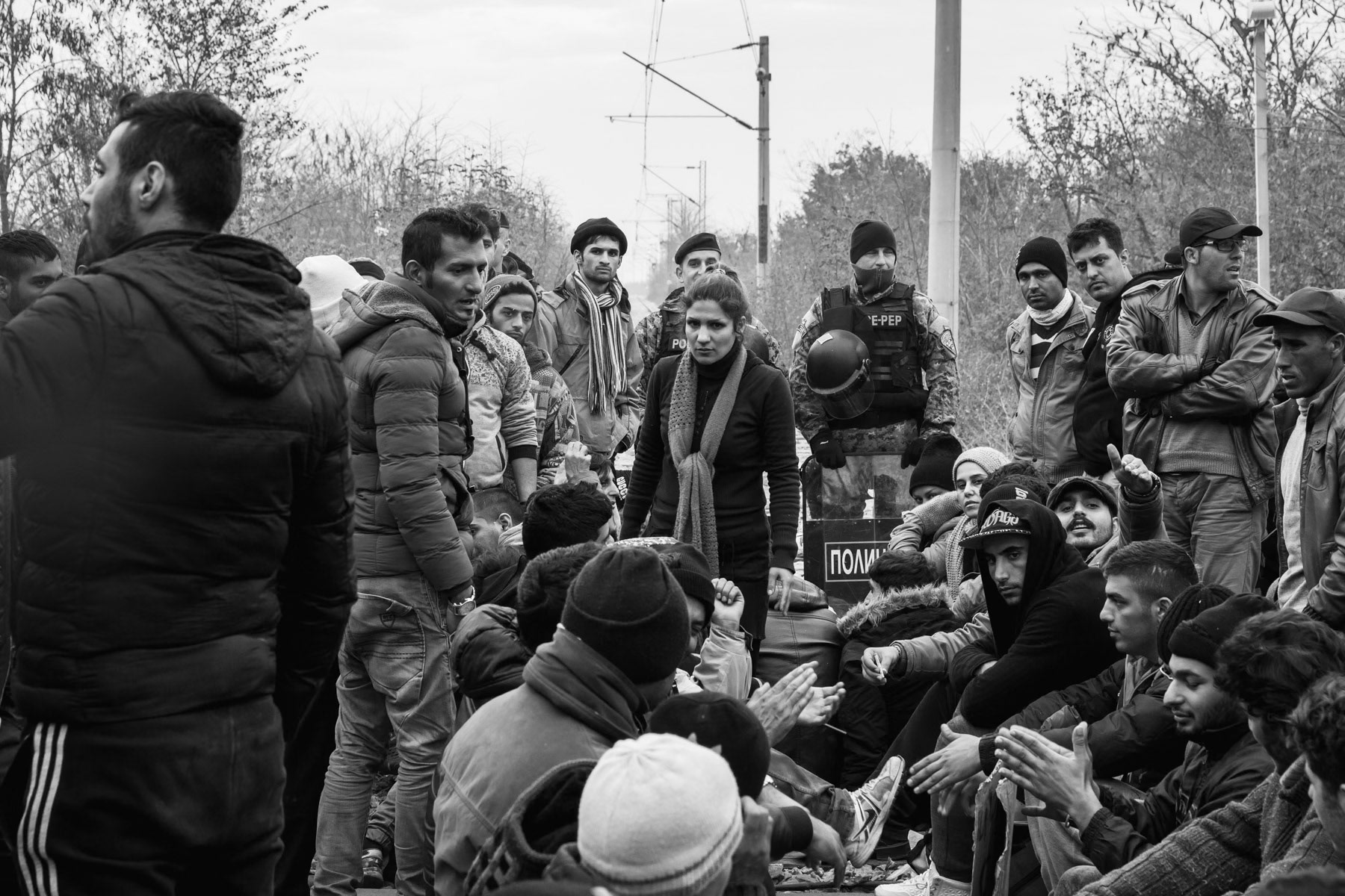 Border crossing between Greece and Northern Macedonia when passage started to be restricted to only conflict zone refugees. Standed Iranian and Pakistani refugees. Idomeni, Greece, November 2015