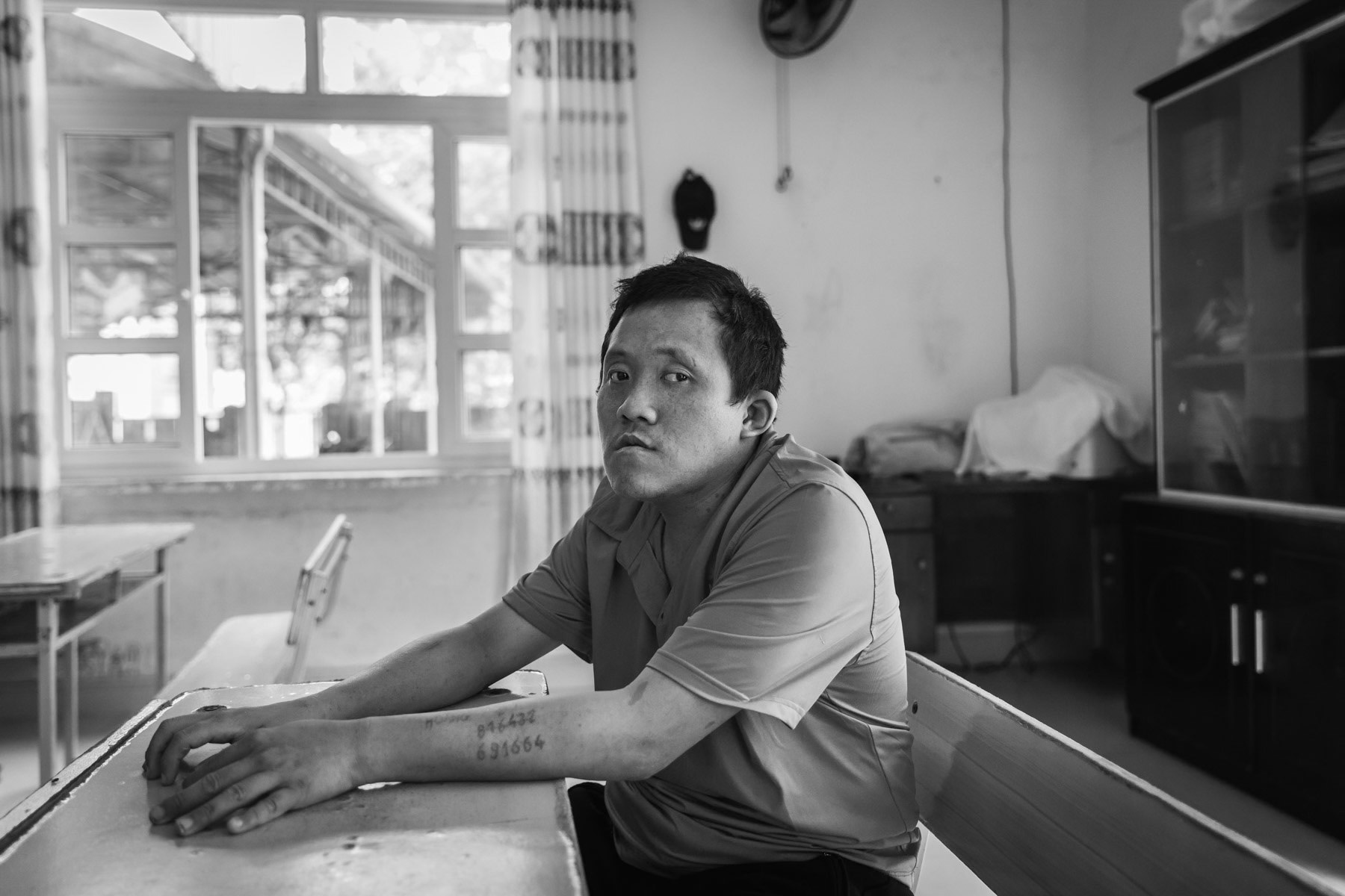 Agent Orange victim in a day care centre managed by the Vietnamese Association for Agent Orange Victims (VAVA). Agent Orange is a chemical defoilant rich in dioxin that was massively used by the American Army in clearance operations during the Vietnam War. Although its use was stopped in 1971, almost 50 years later desendants of affected victims are still born with mental and/or physical problems due to the toxicity of the dioxin passed on through generations. Da Nang, Vietnam, April 2018