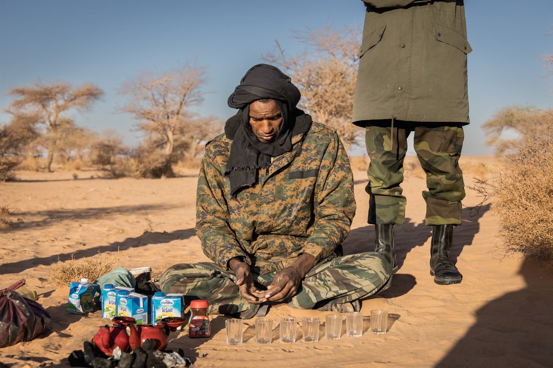 Sahrawi soldiers preparing tea before moving. Organised as a guerilla, Sahrawi military change their camp location on quasi daily basis and are extremely mobile. Liberated territories of the Sahrawi Arab Democratic Republic, October 2021