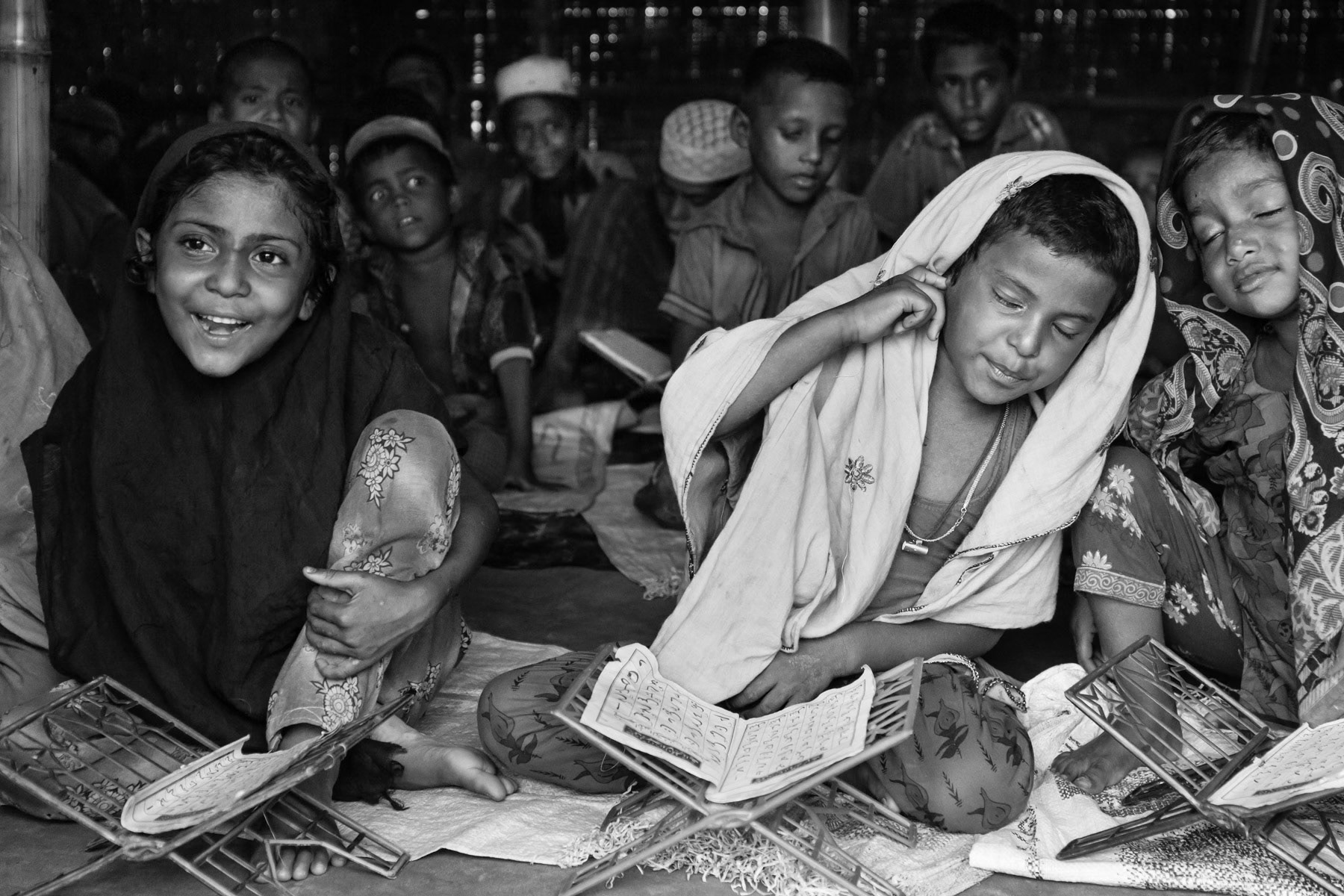 Rohingya refugees at an informal coranic school. Medresas are usually the only from of education that un-registered refugees have. Teknaf, Bangladesh, June 2015
