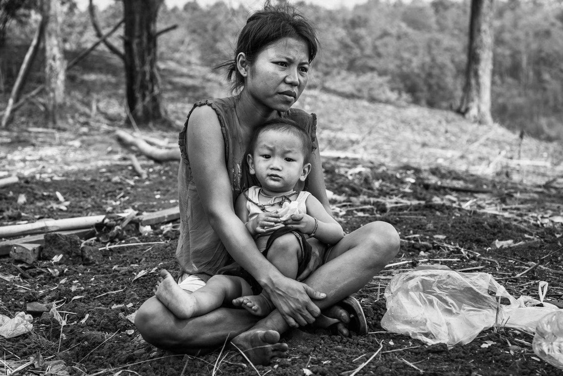 Mother and her child from the Karen ethnicity in territories under control of the ethnic armed groups resisting against the persecution of the military junta. Kaw Tho Lei, Karen State, Myanmar, May 2024