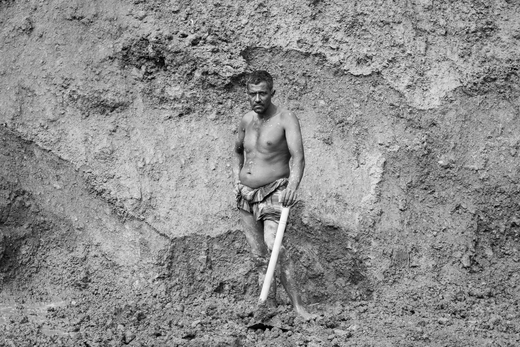 Clay digger, primary material for brick production, Amin Bazar brick fields, Bangladesh, December 2015