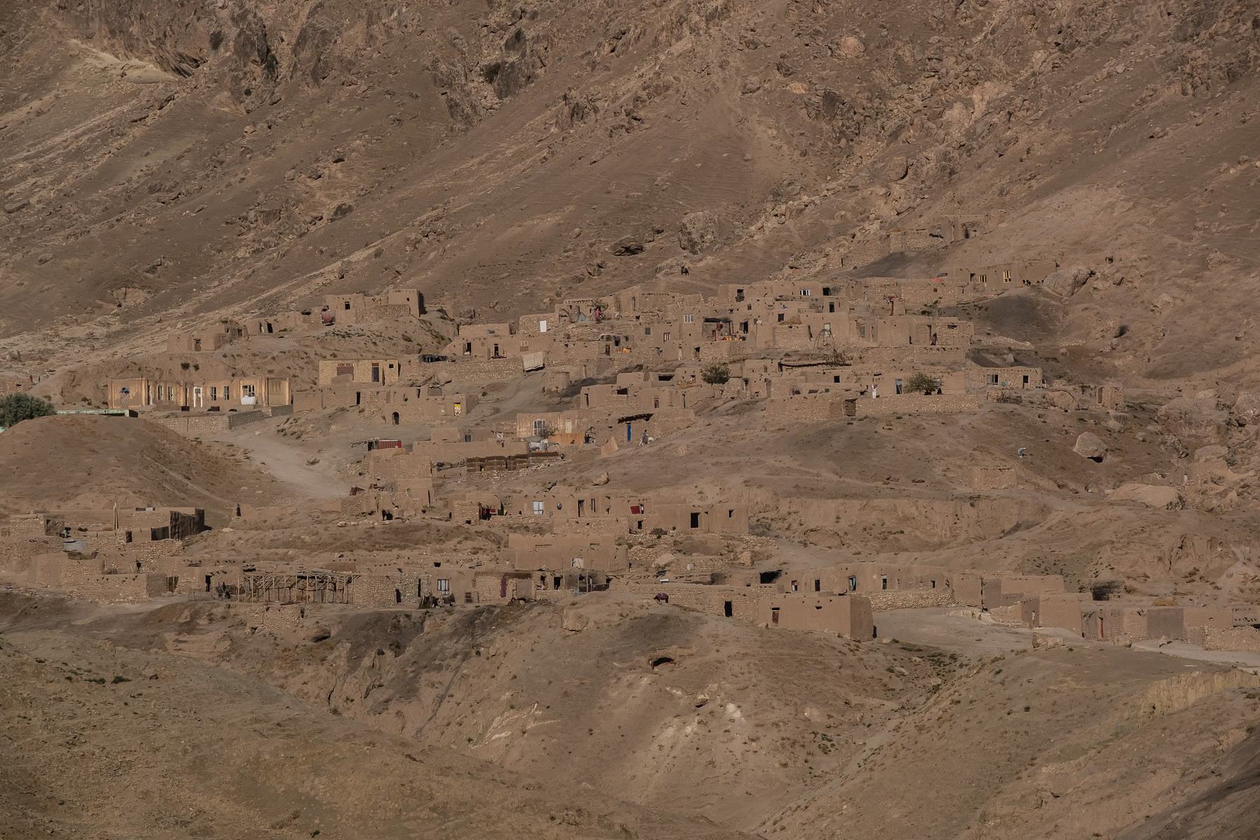 Afghan mud brick hillside village in the Tangi Shadian Valley south of Mazar-i-Sharif in Balkh province. Afghanistan, September 2024