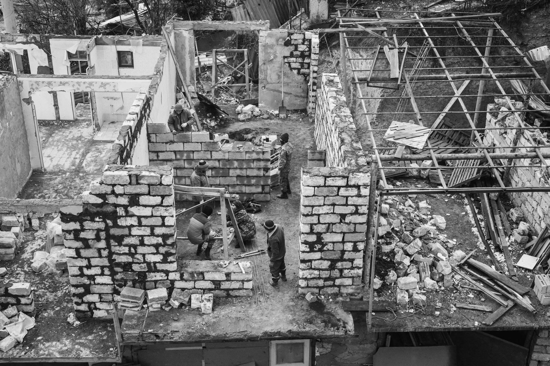 Shelled houses. Starting on the 27th of September 2020, the Azerbaijani artillery and drones kept Stepanakert, the capital of Nagorno-Karabakh, a town with a population of 50,000, under fire for 44 days. Human Rights reports highlighted the use by both sides of banned munitions such as cluster munitions and artillery rockets that did not distinguish between military targets and civilian structures. Armenian forces have also hit several times densely populated areas with rockets within Azerbaijan, in particular the second largest city of the country, Ganja. Stepanakert, Nagorno-Karabakh, December 2020