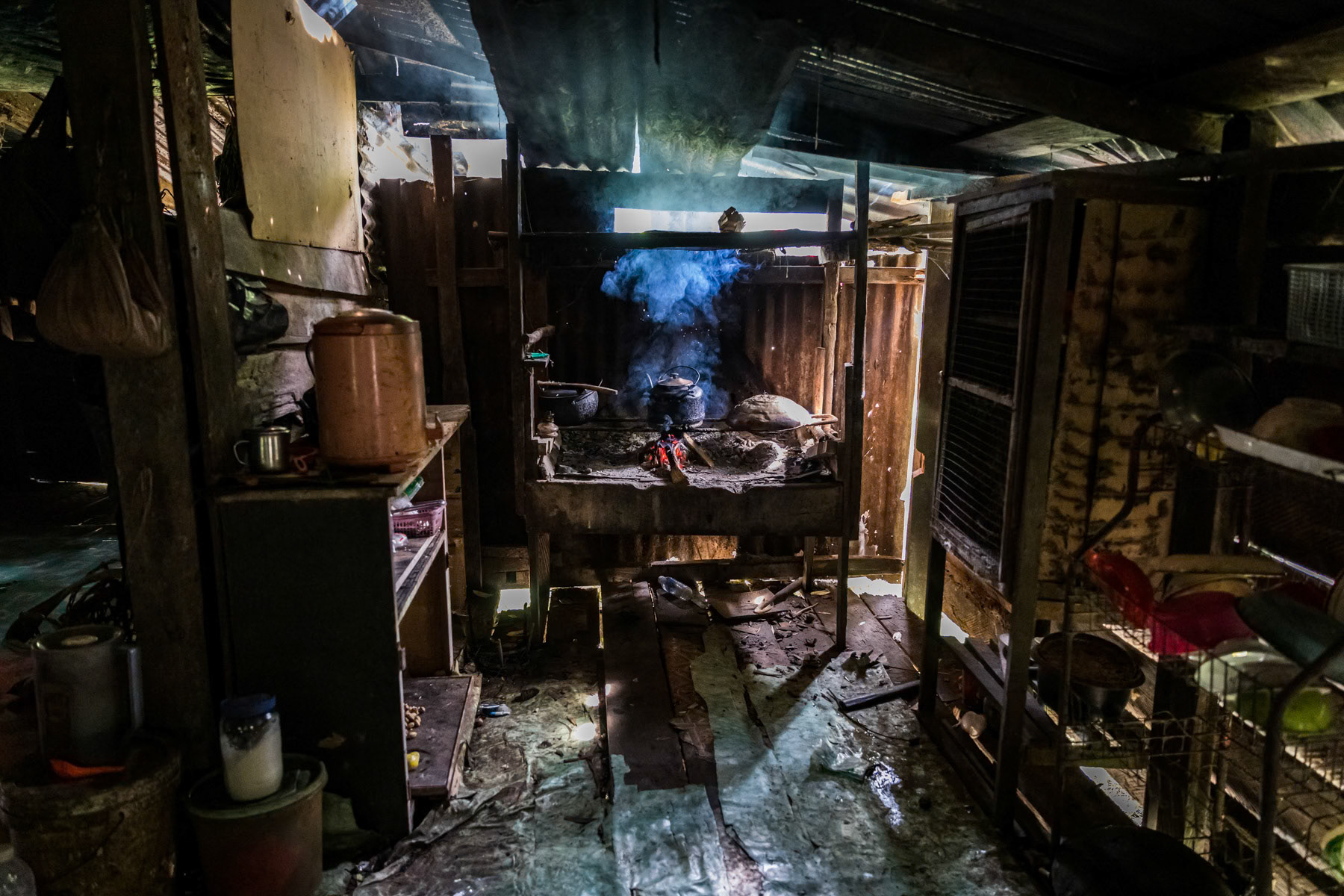 Interior of a typical long house nesteled deep in the jungle where indigenous people will spend several days, sometimes weeks, hunting. Sarawak Rainforest in Malaysian Borneo, February 2020