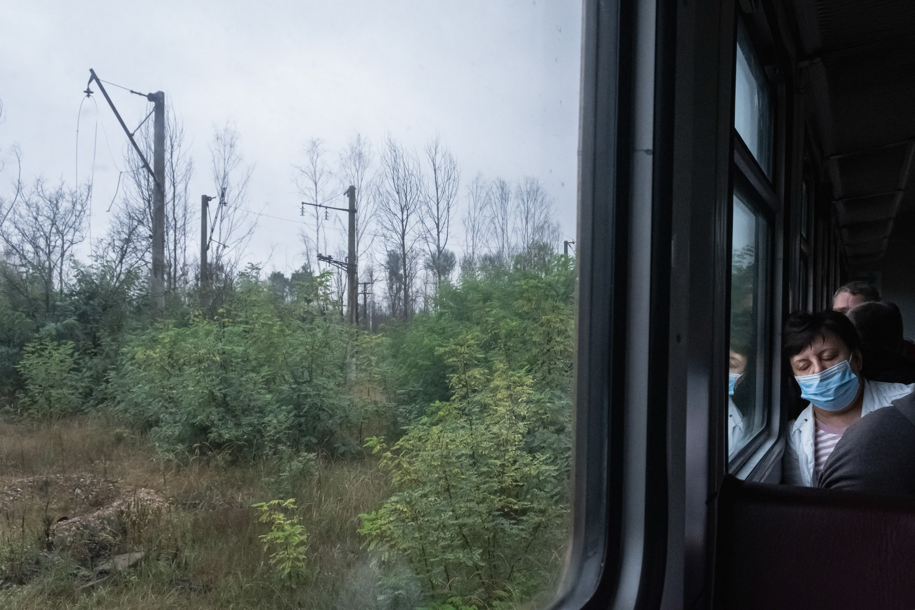 Shuttle train between Slavutych and Chernobyl passing through the exclusion zone in Belarus. Every day thousands of habitants of Slavutych take the train to go working at the Chernobyl NPP and other locations within the exclusion zone. Belarus, August 2021