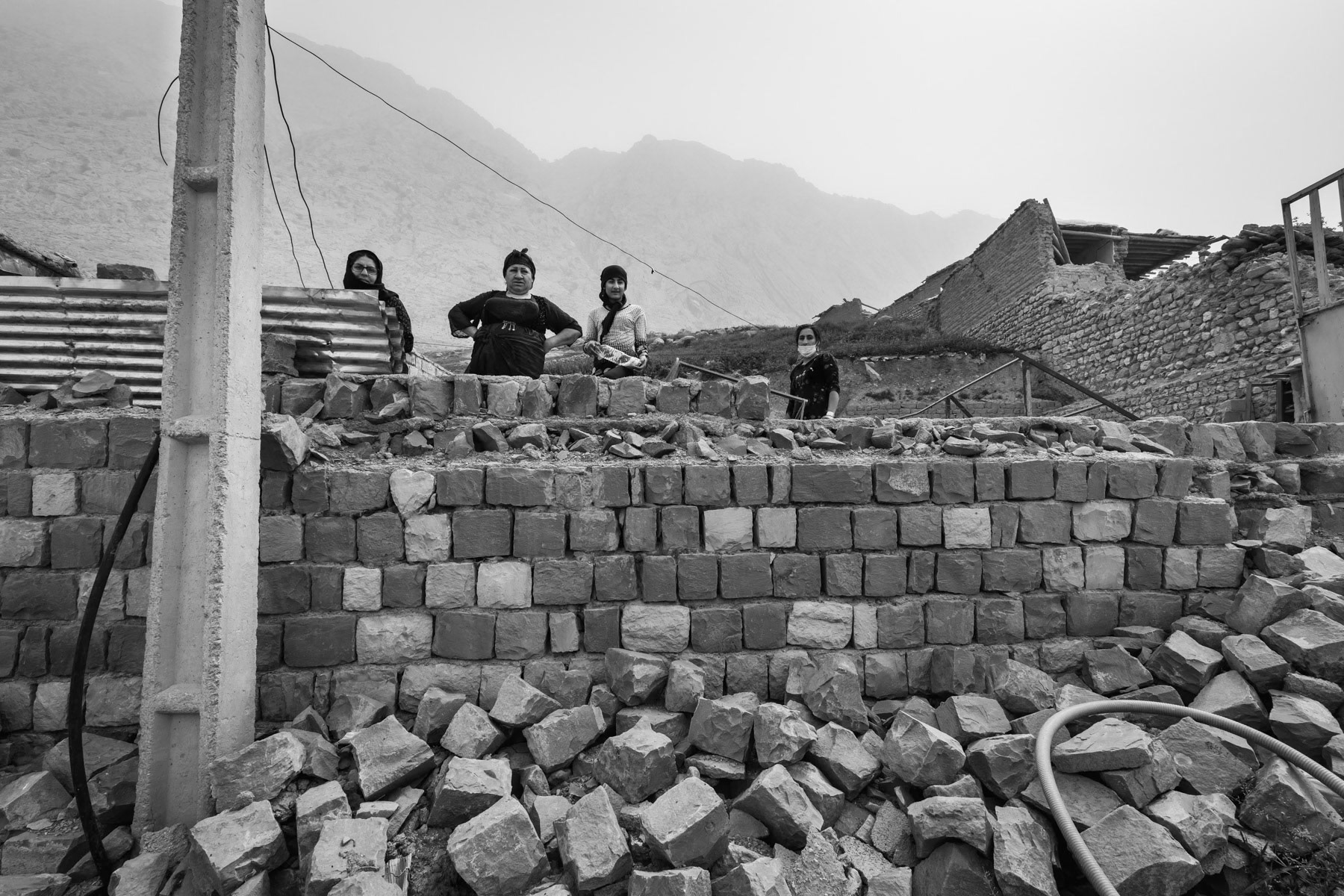 Residents of Zardeh in their destroyed house by a deadly earthquake in December 2017. Zardeh, Kermanshah Region, Iran, April 2018