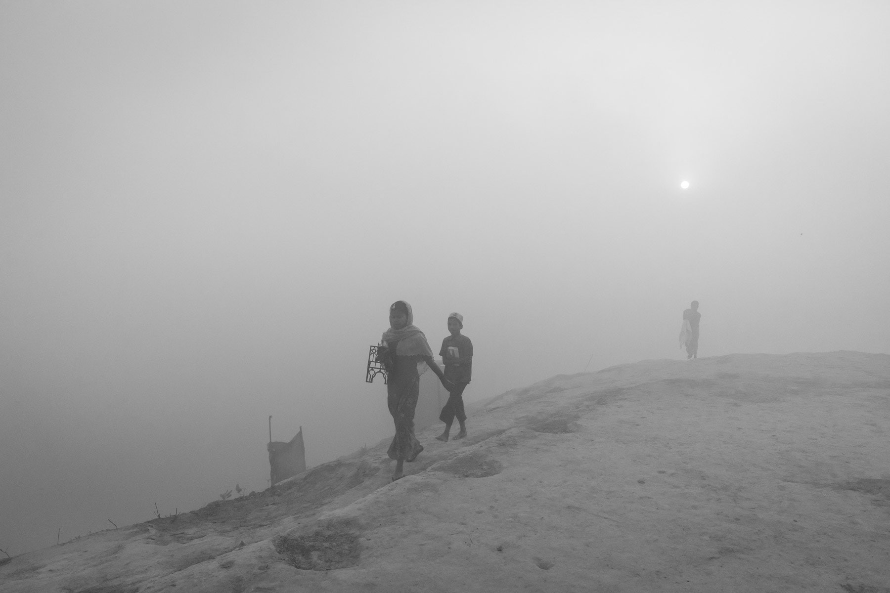 Rohingya children on the way to the medressa during the early morning hours. Thangkhali refugee camp, Ukhiya, Bangladesh, March 2018