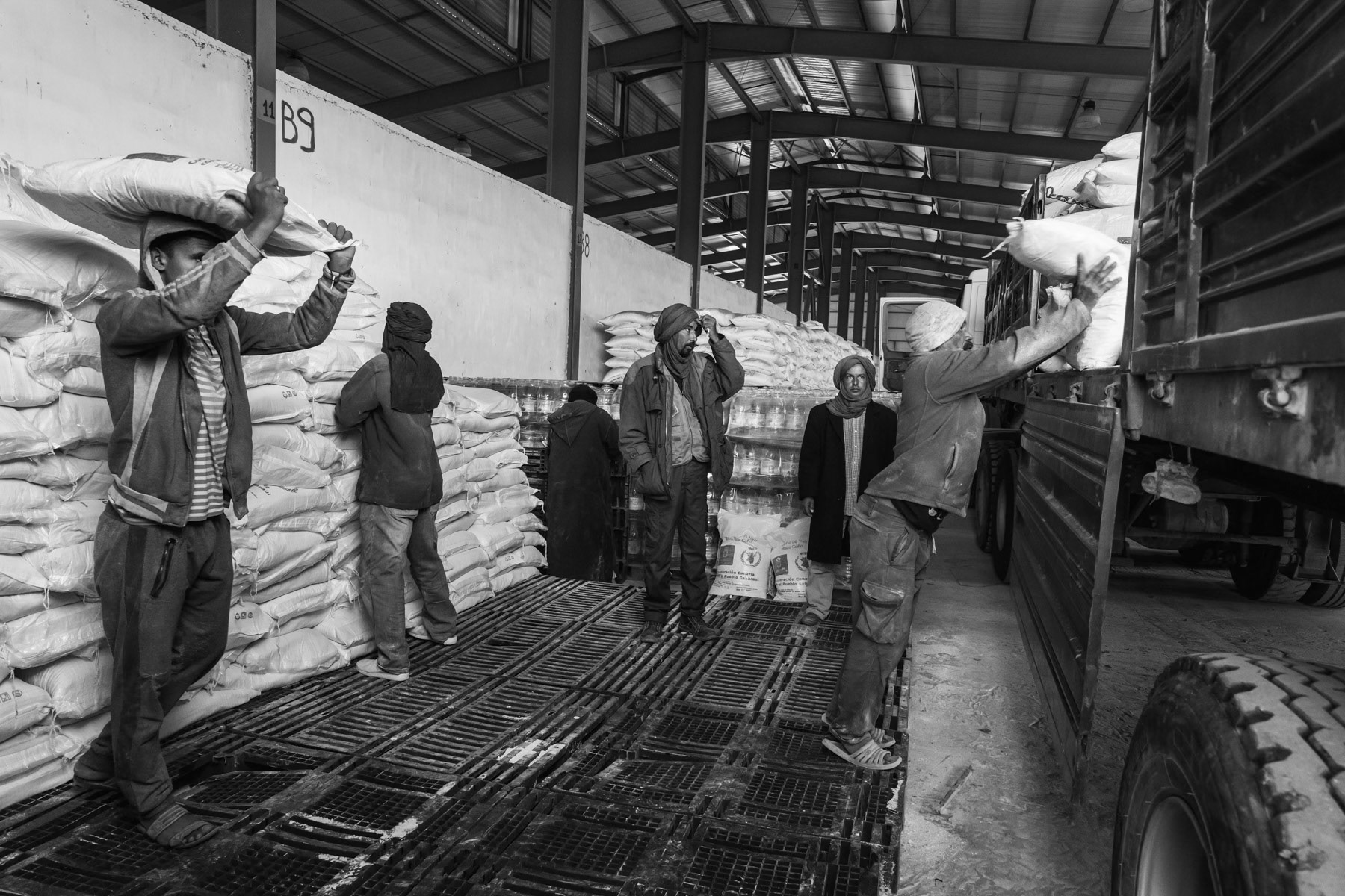Central Warehouse of the Saharawi Red Crescent from where WFP food items are being distributed throughout the 5 Saharawi refugee camps. Saharawi refugees living in the camps in the Southern Algerian desert, depend on international aid and food distrubutions to subsist for the past 40 years. Rabouni, Tindouf, Algeria, December 2019