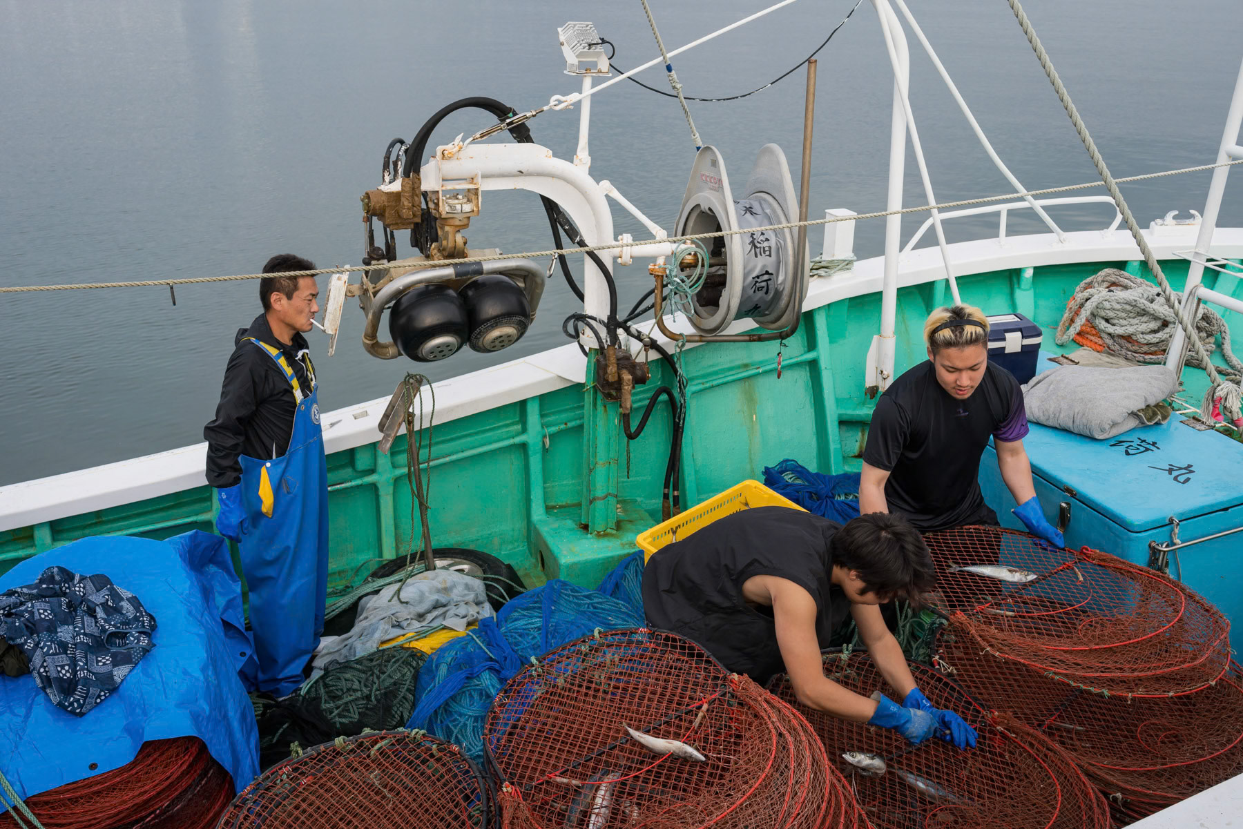 Fishermen preparing their nets and boat at the Soma fishing port about 40 Km north of the Fukushima nuclear power plant where treated cooling water is being released in the ocean after the green light of the international agency for nuclear energy. Soma, Fukushima, Japan, October 2023
