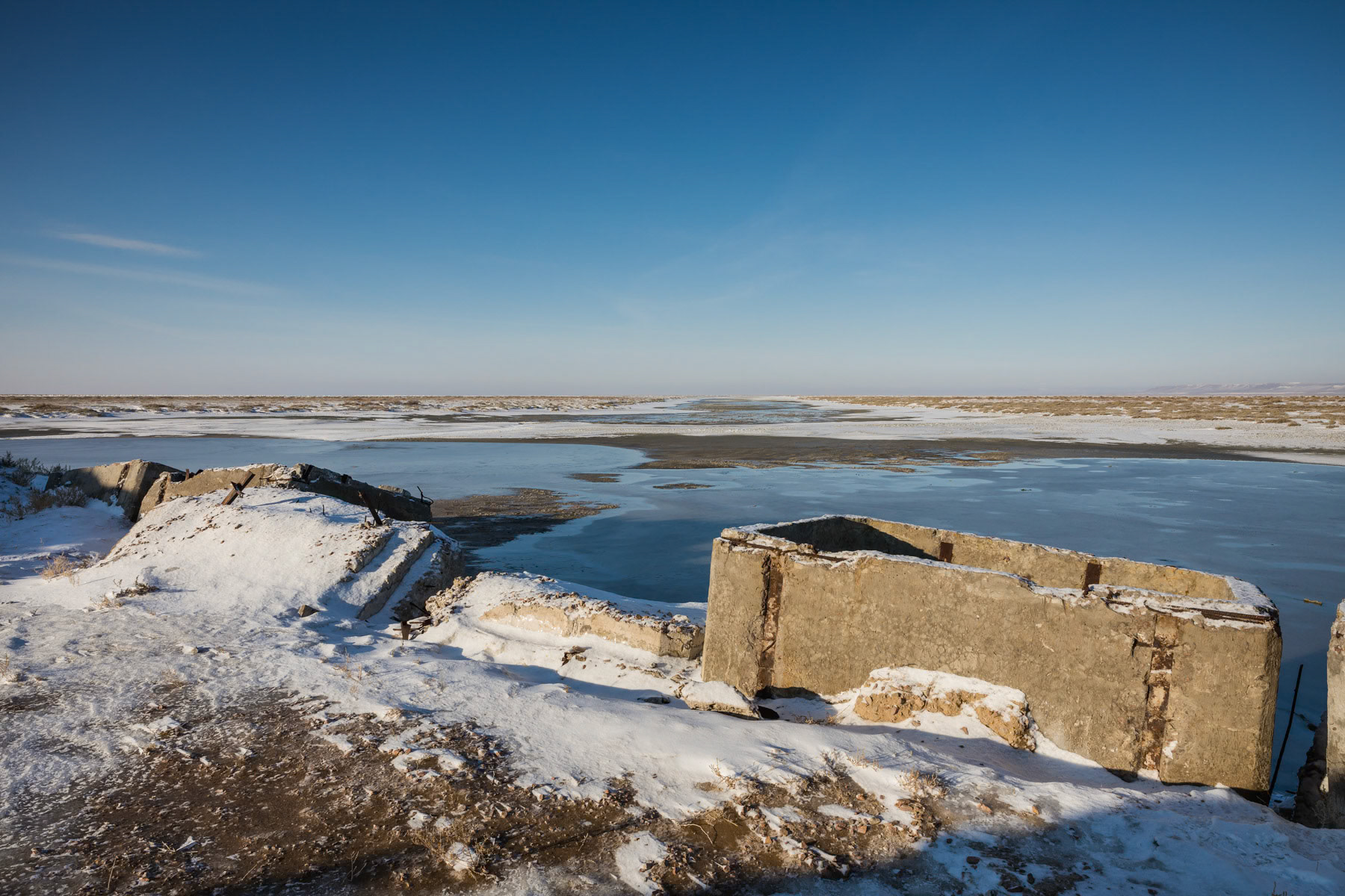 Remainders of a dock on the Aral Sea near Zhalanash. Kazakhstan, January 2019