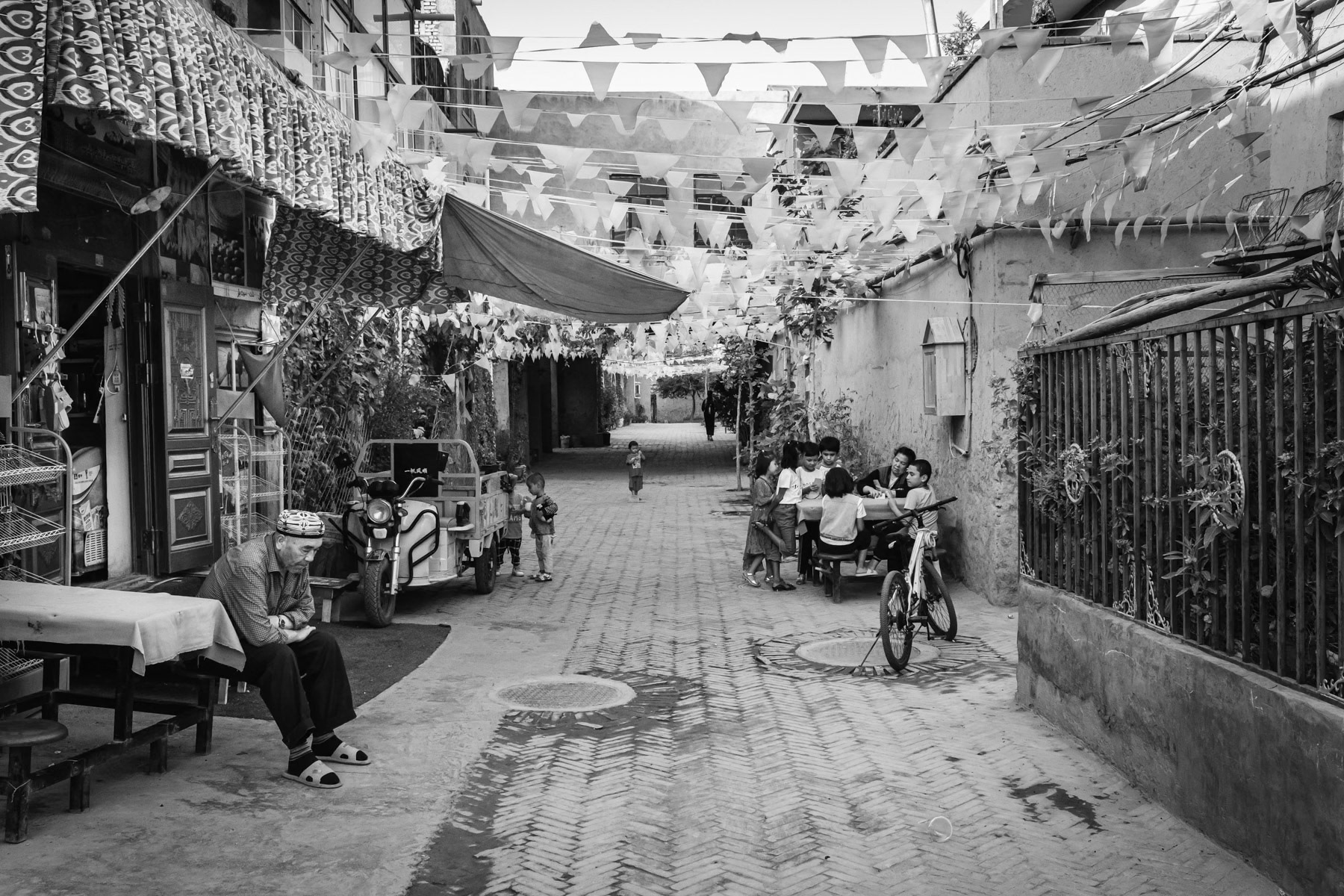 The "new" old town of Kashgar. The old town was completely renovated and rebuilt, many neighbourhoods got razed and replaced by new housing projects keeping the look of the old town architecture. Kashgar has a large majority of Uyghur residents. Xinjiang, China, September 2019