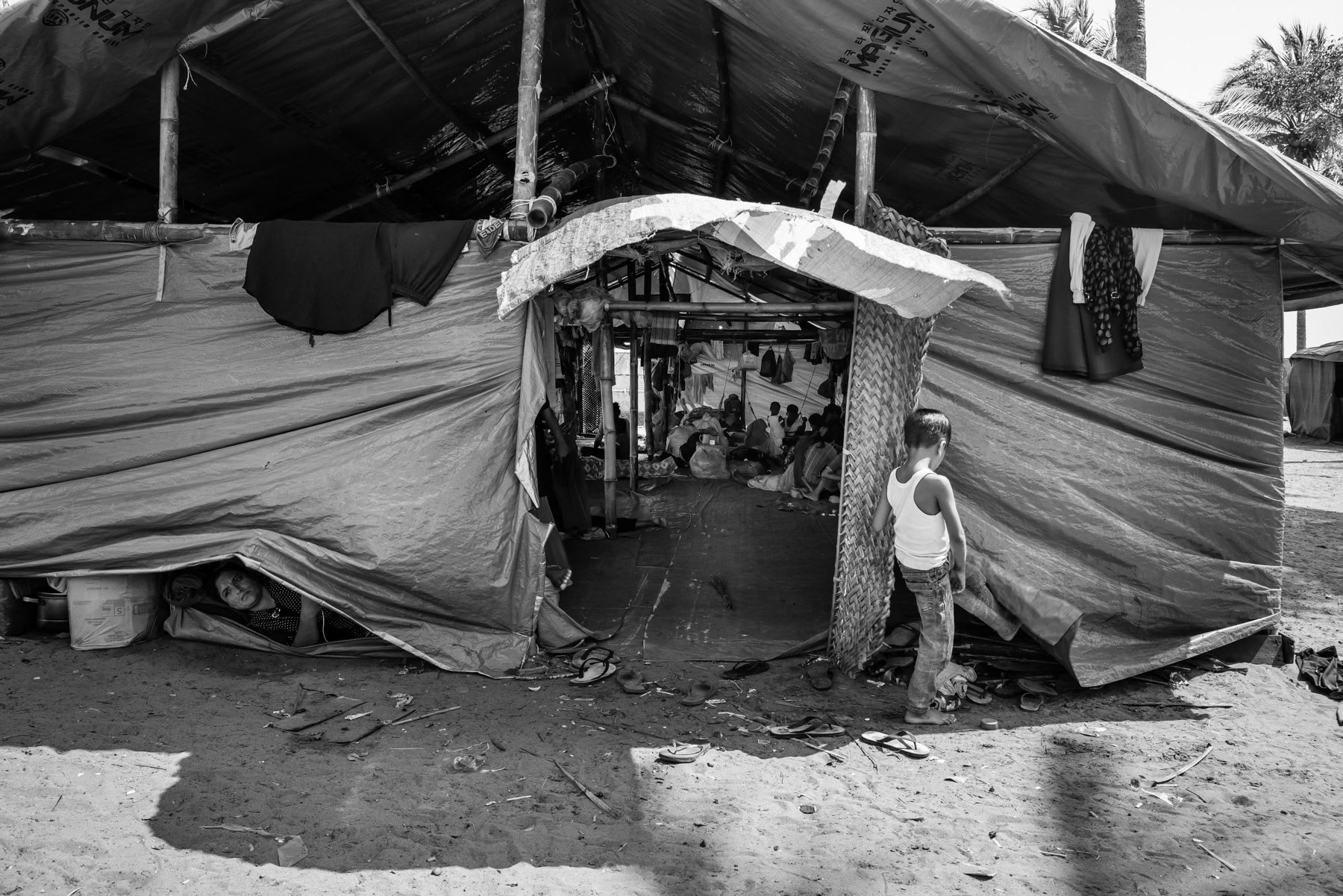 Stranded Rohingya boat people from Burma that have arrived recently on the coast of Aceh. They are sheltered on the beach where arrived 3 months ago. Pidie, Aceh, Indonesia, February 2024