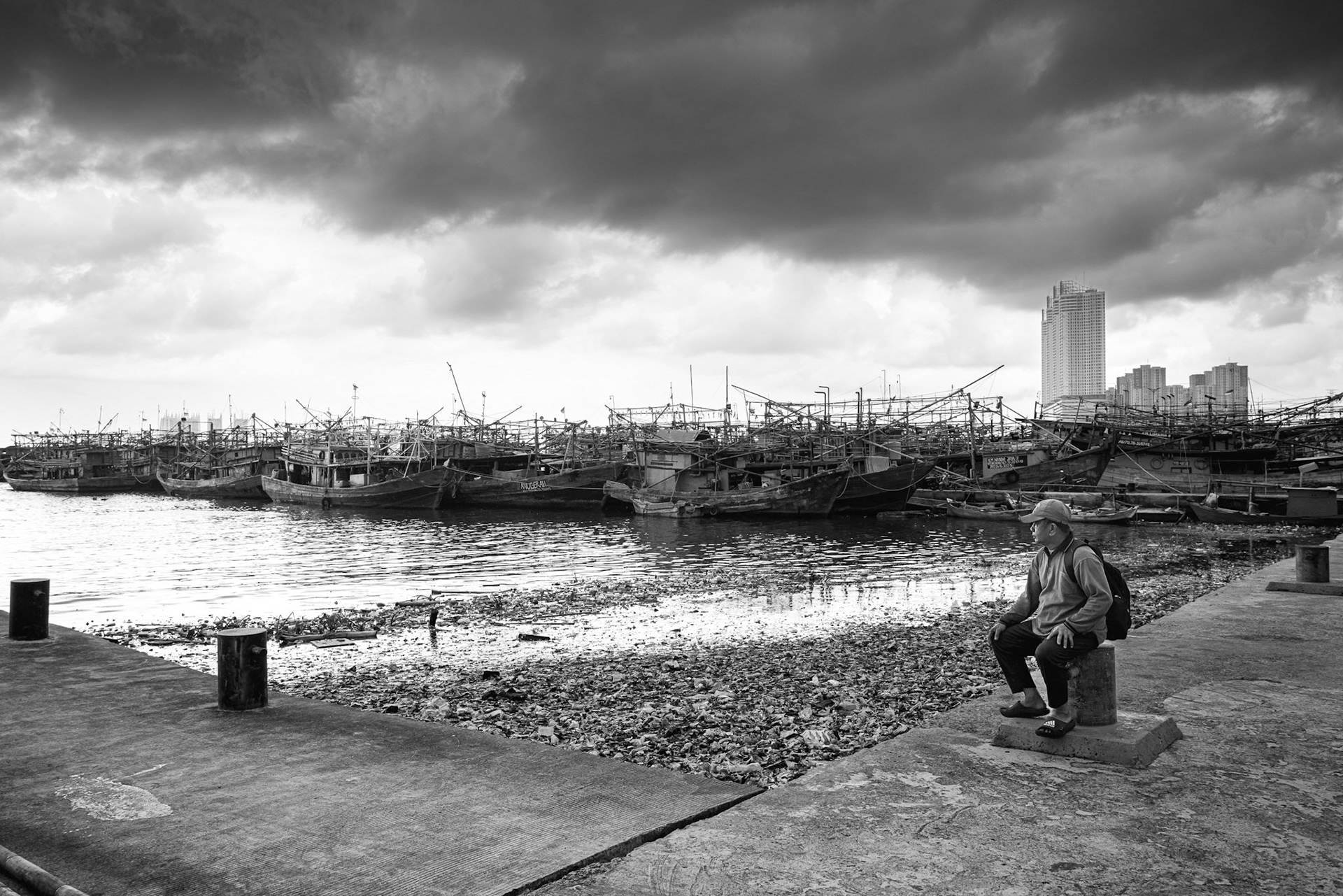 A moment of stillness in a harbor that is slowly being reclaimed by the Java Sea. Jakarta, January 2026