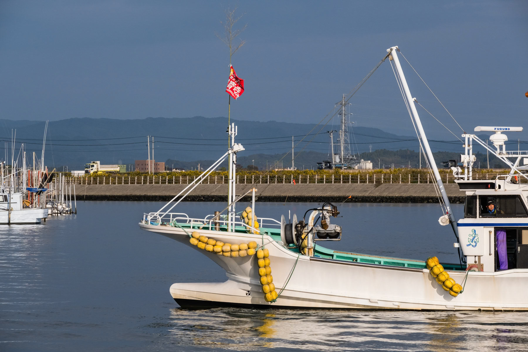 Soma fishing port 40 Km north of the Fukushima nuclear power plant. Since the nuclear disaster of 2011 it has been extremely difficult to restart a sustainable fishing industry along the Pacific coast. Since 2023 treated cooling water is being released in the ocean after numerous tests and studies claiming it is not harmful to marine life, environment and people's health. However, confidence is very low and regional boycott have devastated an already hardly recovering fishing industry so important for the region. Soma fishing port, Fukushima, October 2023