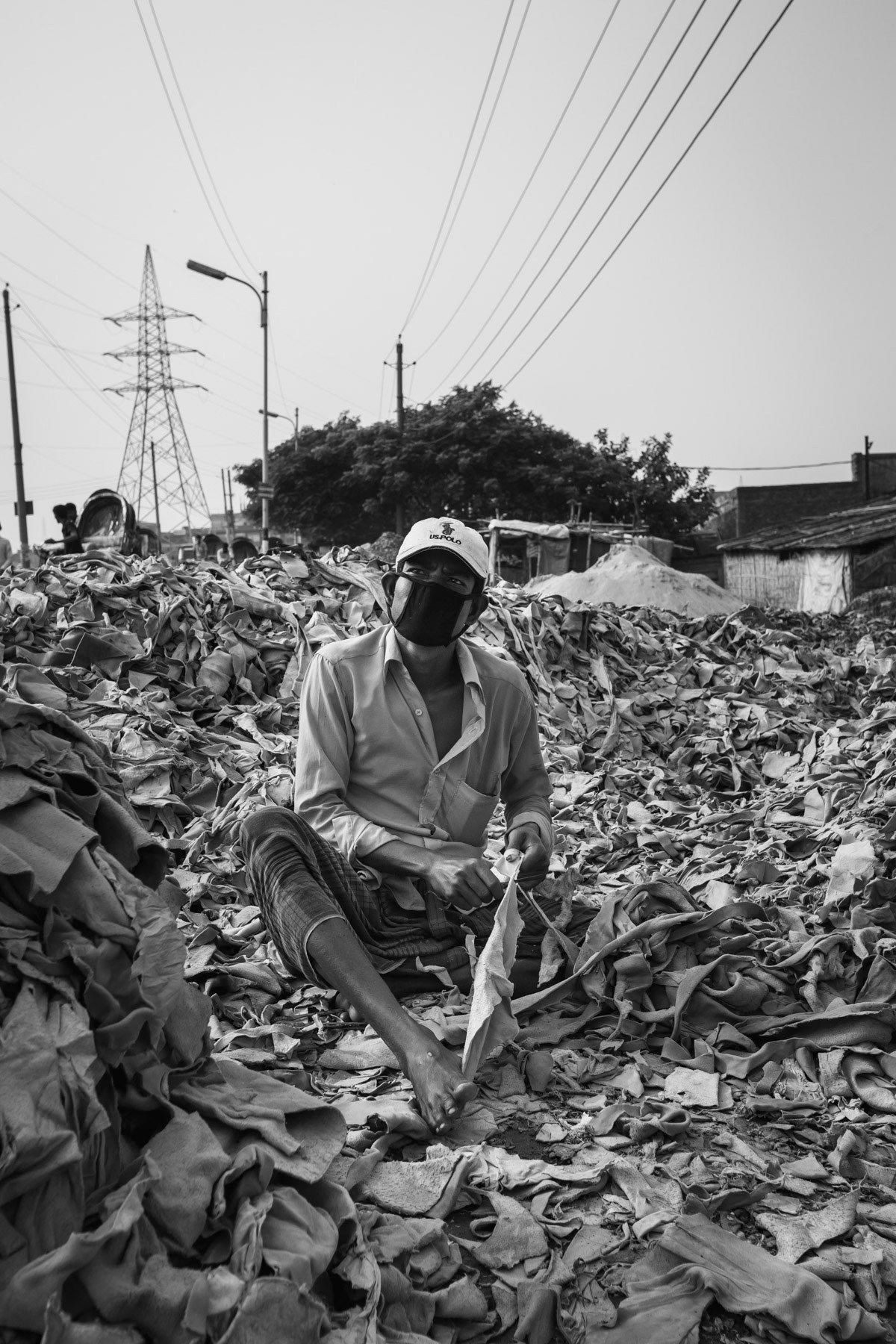 Finding usable leather leftovers for local garment production, Hazaribagh, Bangladesh, October 2014