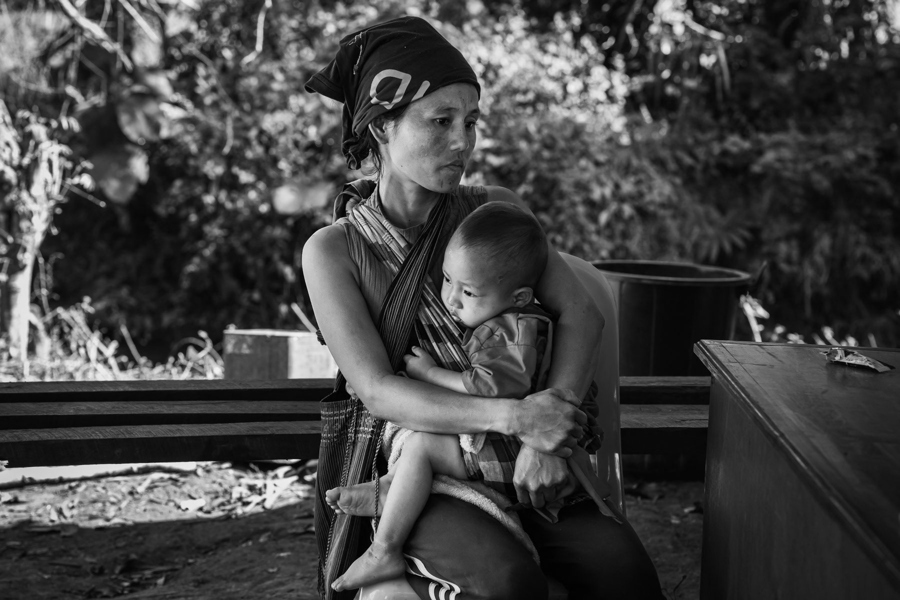 Mother and child at the clinic of an IDP camp located in the jungle. Kanele area in Karen State, Myanmar, January 2024