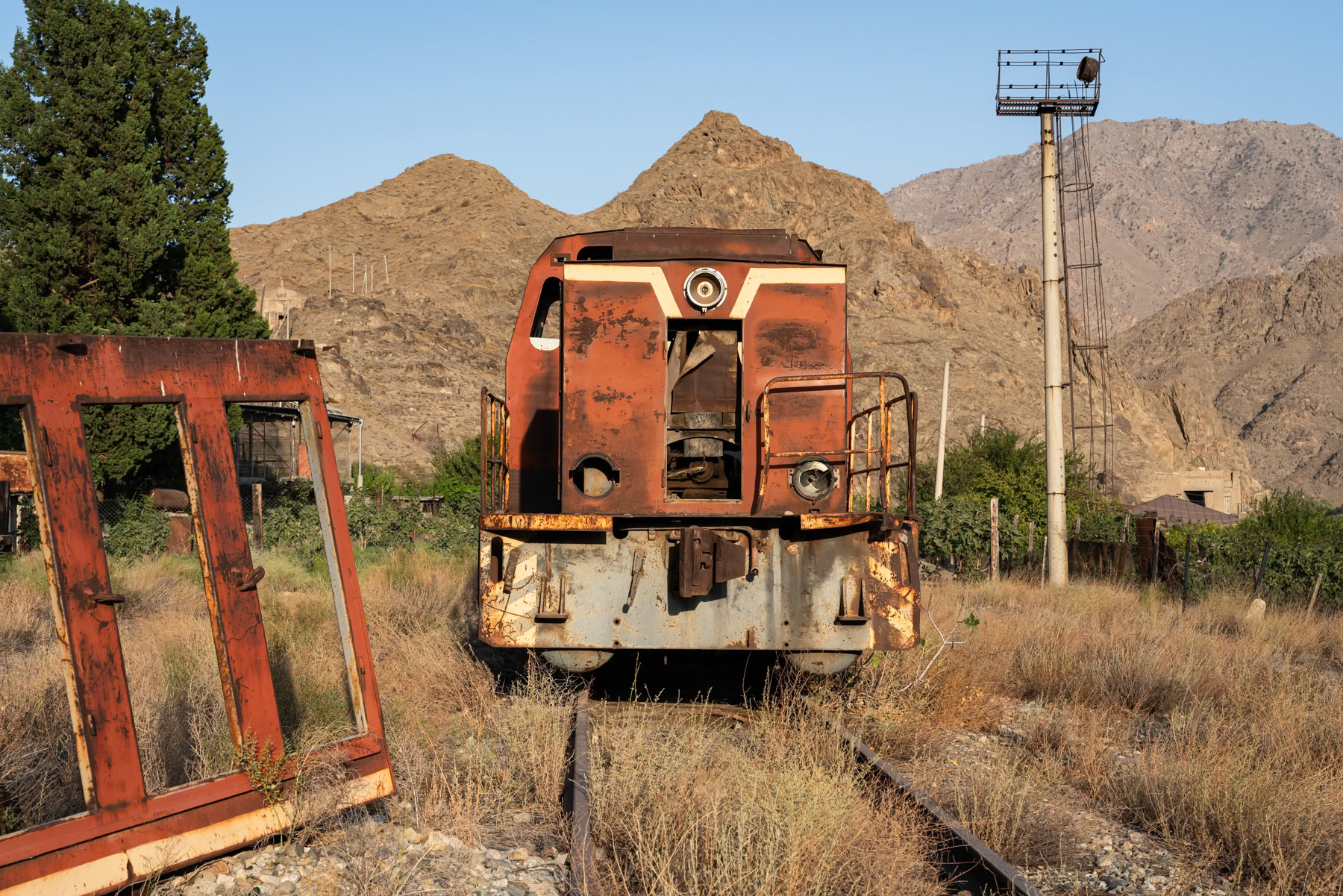 The old Meghri train station, used in the Soviet era to connect Yerevan, Nakhchivan, Nagorno-Karabakh, and Baku via this railway corridor in southern Syunik. In the background, you can still see the railway's mountain tunnels. Meghri, Syunik, Armenia, September 2025