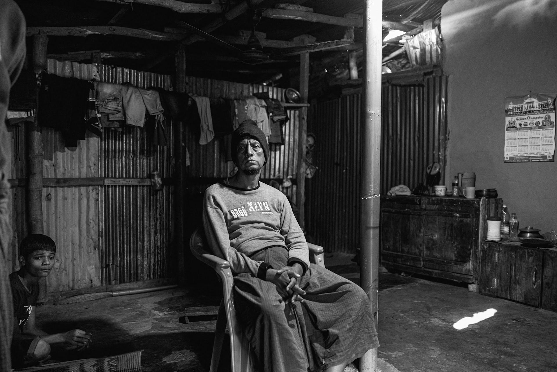 In this photo, Aji Nur, a 13-year-old boy who lives with mental health challenges, is seen with his uncle in Balukhali camp. Aji Nur was injured by shrapnel during a 2024 Arakan Army drone strike on his family home in Maungdaw downtown.The attack instantly killed his father, Md Isaak (45), and left his mother, Morijan (42), and two others wounded. Now displaced in Bangladesh, Aji Nur remains under the care of his surviving family members as they cope with the physical and psychological aftermath of the strike. Balukhali camp in Bangladesh, January 2026
