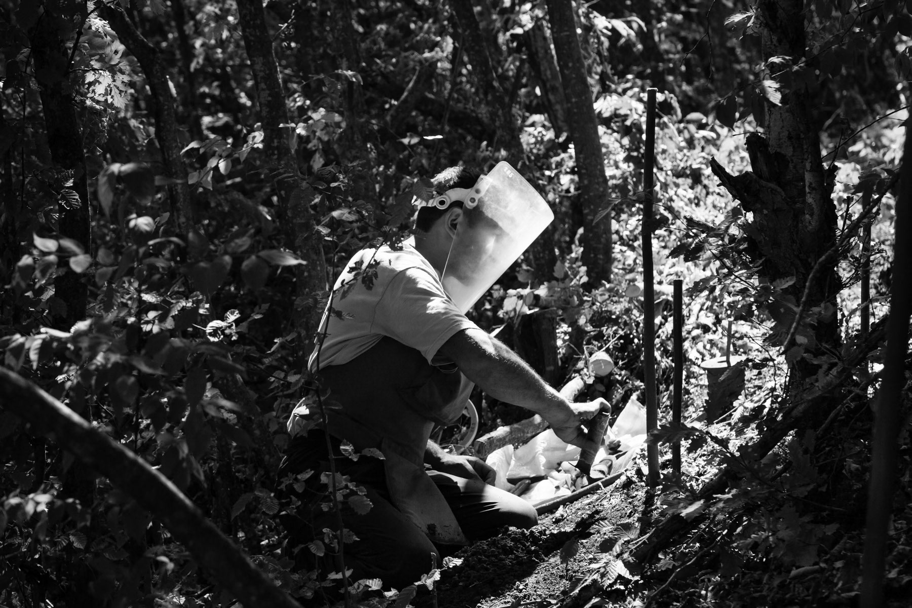 Nagorno Karabakh has one of the world's highest per capita rates of accidents caused by mines, cluster munitions and other explosive remenants of war. The HALO trust is the only international NGO present in Karabakh and has since 2000 provided the sole capacity in the region for the clearance of mines and the disposal of unexploded ordnance. Mines and unexploded ordnance have a profound impact upon day-to-day lives of the rural population and dramatically affect the income of thousand of poor families. The international isolation of Nagorno Karabakh that impovrishes the people of Karabakh also makes it extremely difficult for the HALO Trust to raise funds to work in that region. Manual mine clearance in the woods. The HALO Trust at work, Khramort minefields, Nagorno-Karabakh, July 2014
