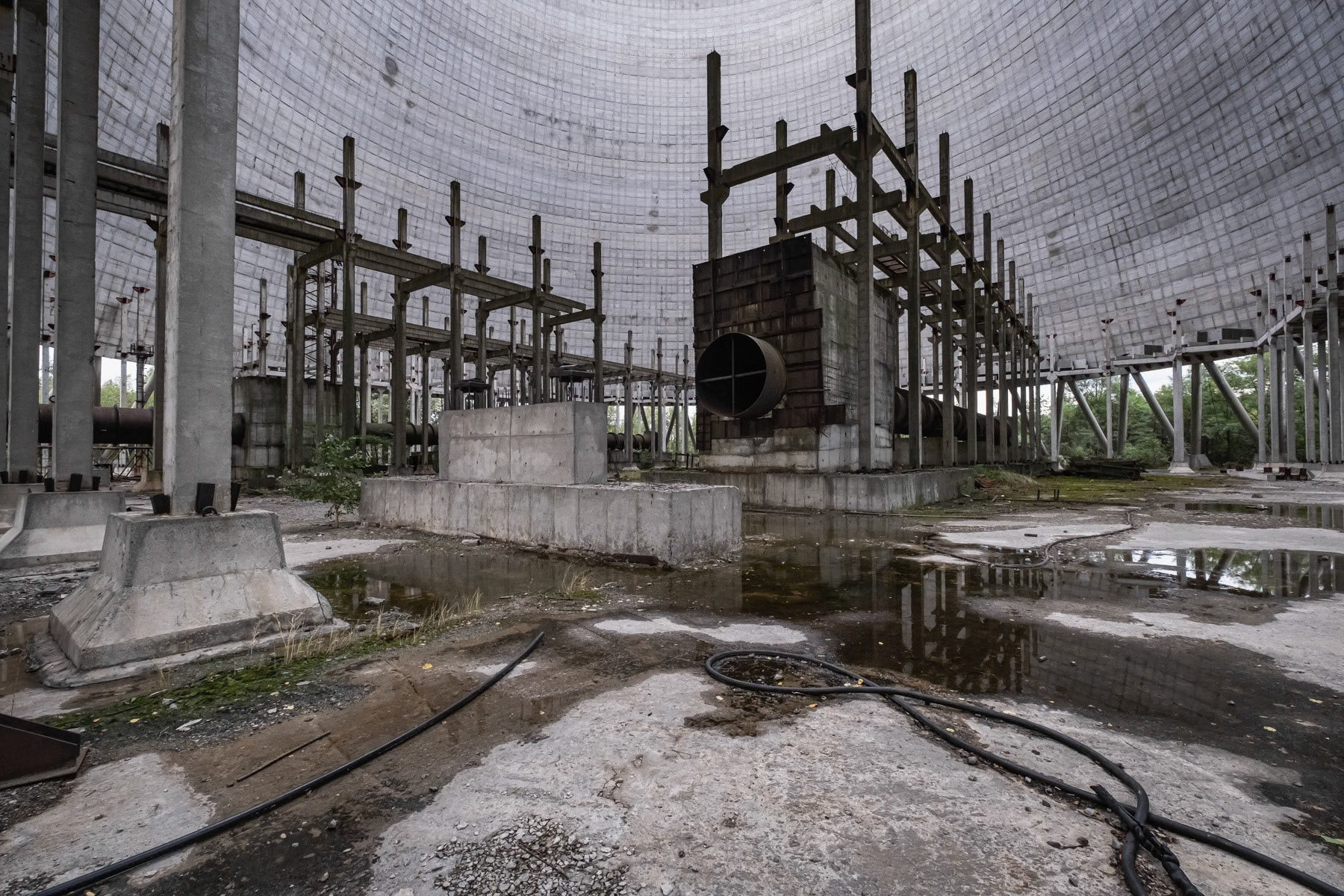 Unfinished cooling tower, from the inside, of nuclear power plant 5 and supposed to be put in function in October 1986. After the explosion of reactor 4, all expansion works were stopped indefinitely. Plans existed to expand the Chernobyl nuclear power plant (NPP) to ten reactors by the year 2000 which would have made it the largest in the world. The accident of 26 April 1986 and later the collapse of the Soviet Union put a definite halt to it. Chernobyl NPP, Ukraine, September 2021