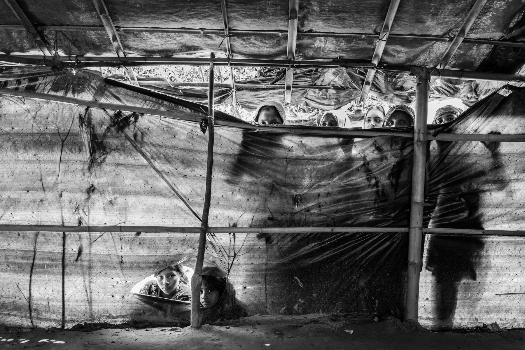 A typical makeshift shelter where several families would find refuge. The shelters are extremely vulnerable during monsoon and cyclone season. Balukhali camp for Rohingya refugees fleeing persecution in Myanmar, Cox's Bazar, Bangladesh, May 2017