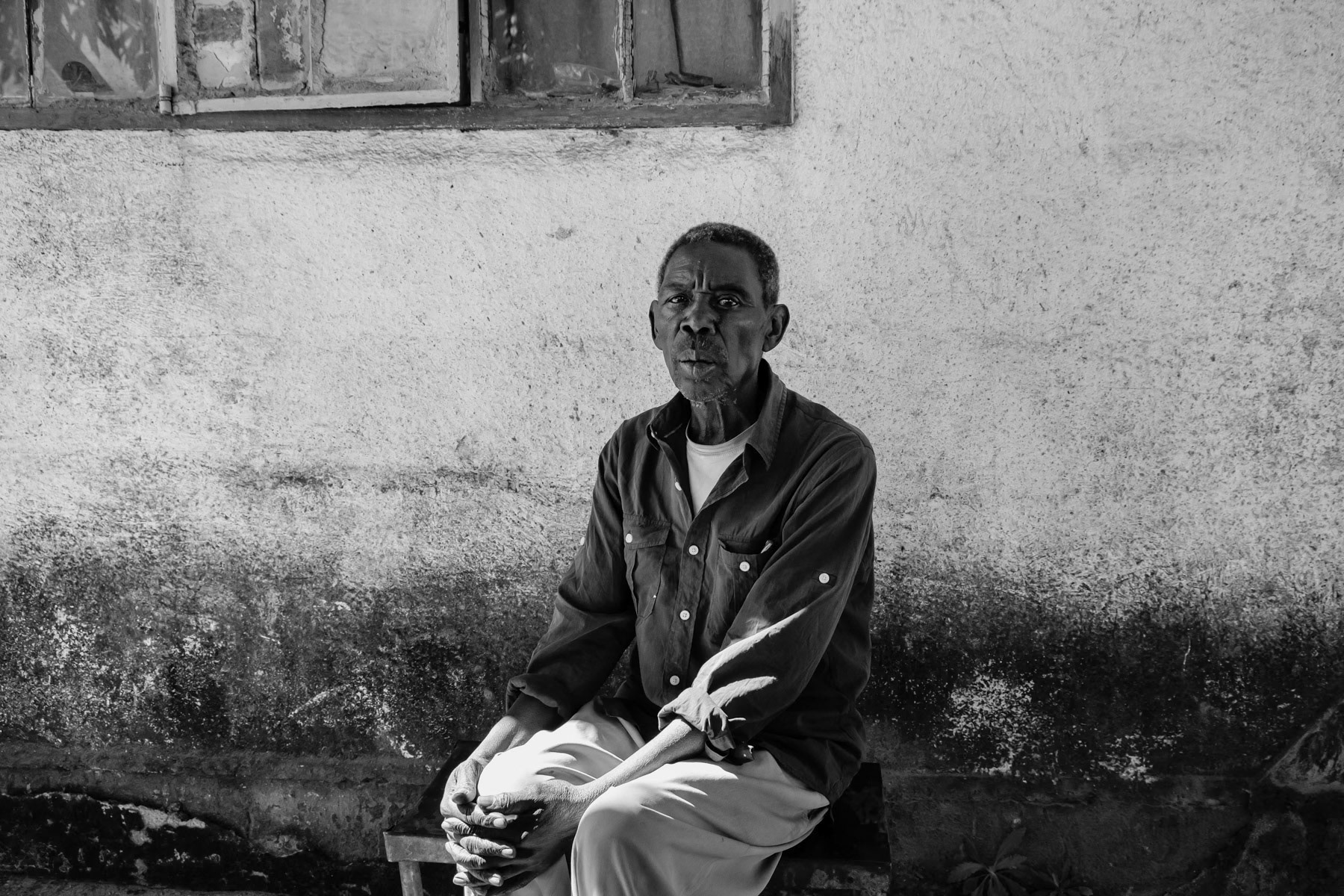 Gatson Luando, 68 years, worked in the Copperbelt mines from 1973 before moving to Kabwe in 1980. Worked in the mine until 1992 before being made redundant and got a one off payment of approximately 300 USD. He worked as a welder after the mine. Lives now in Kasanda neigbourhood, the original miner's neighbourhood, but also one of the most contaminated area with lead particles in the soil. Kabwe, Zambia, May 2021