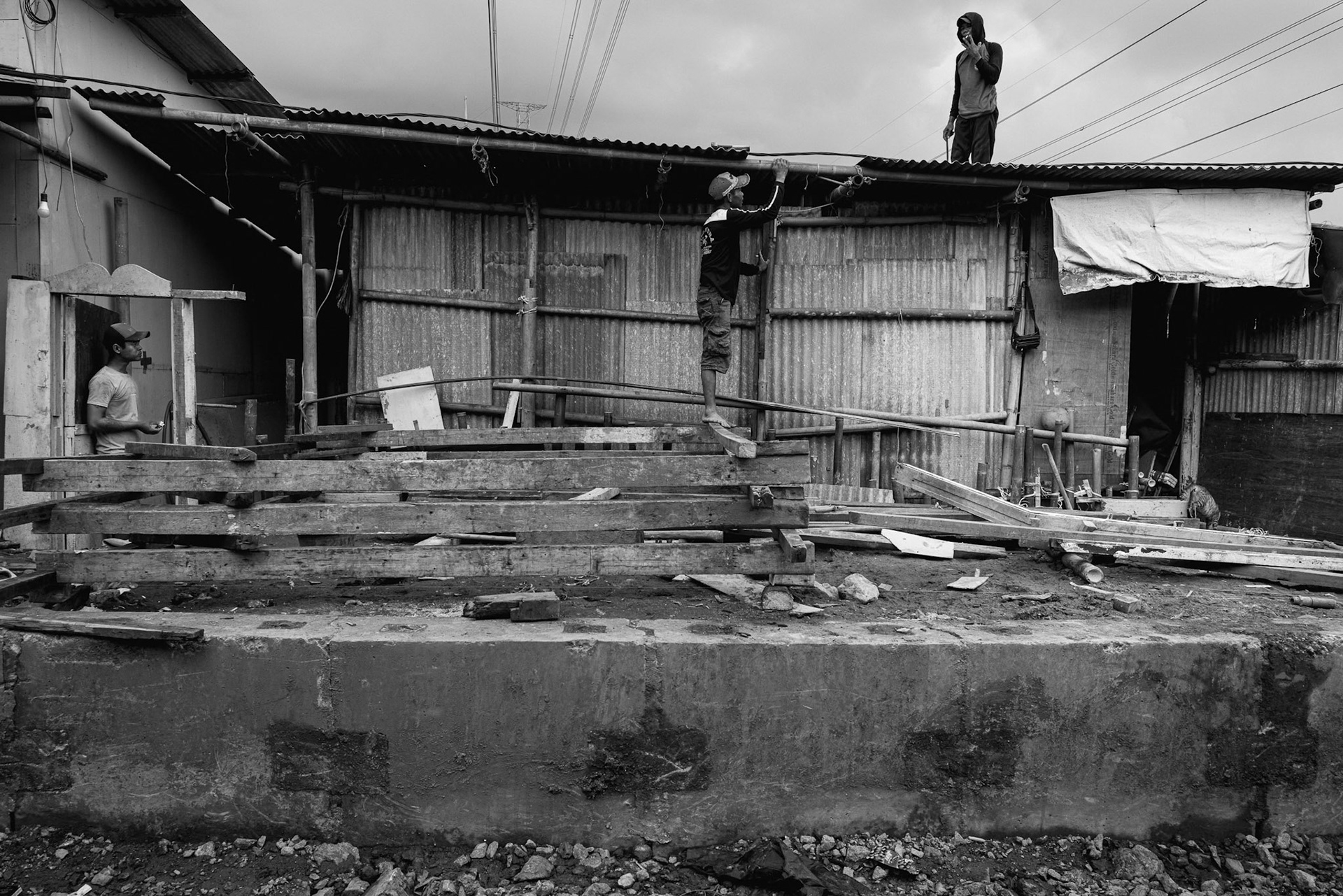 Vertical struggle: Residents are forced to constantly raise their floors and rebuild as the land beneath them subsides. Jakarta, January 2026
