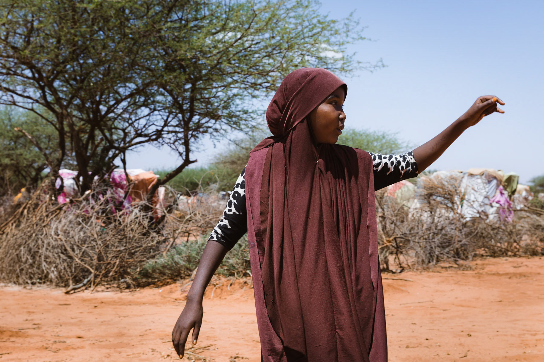 A Somaliland teenage girl stranded in a makeshift camp for climate refugees who lost their livestock because of the drought. Warabeye, Burao Region in Somaliland, October 2017