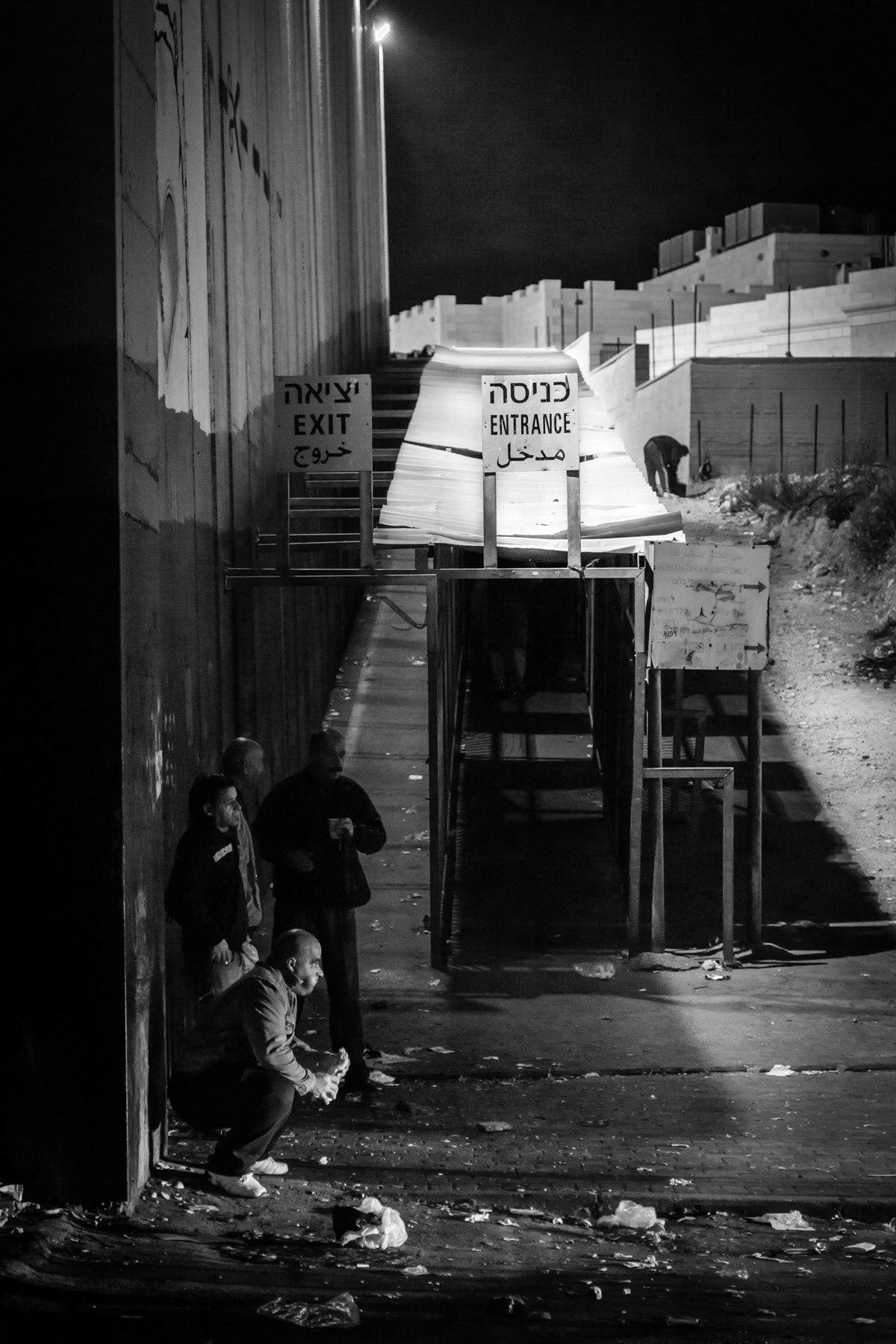 Palestinian workers waiting as early as 3 AM to pass Israeli controls before being allowed access to Jerusalem. Check-point 300 in Bethlehem towards Jerusalem, Palestine, November 2013