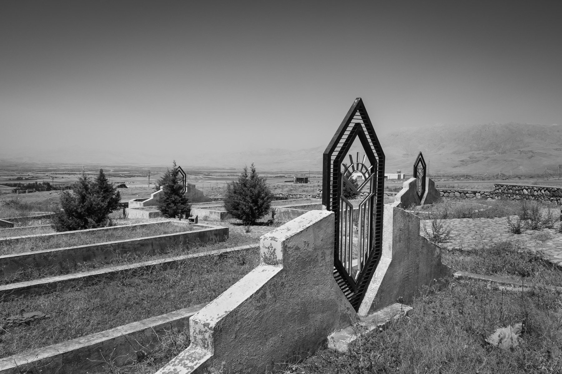 One of the numerous mass graves around Halabja where some of the 5000 victims of the chemical attack on the city are burried. More than 450 chemical shells were dropped on the city and surrounding on 16 March 1988 by Saddam Hussein's army, killing 5,000 and injuring another 10,000 Kurdish civilians. Halabja, Kurdistan, August 2018