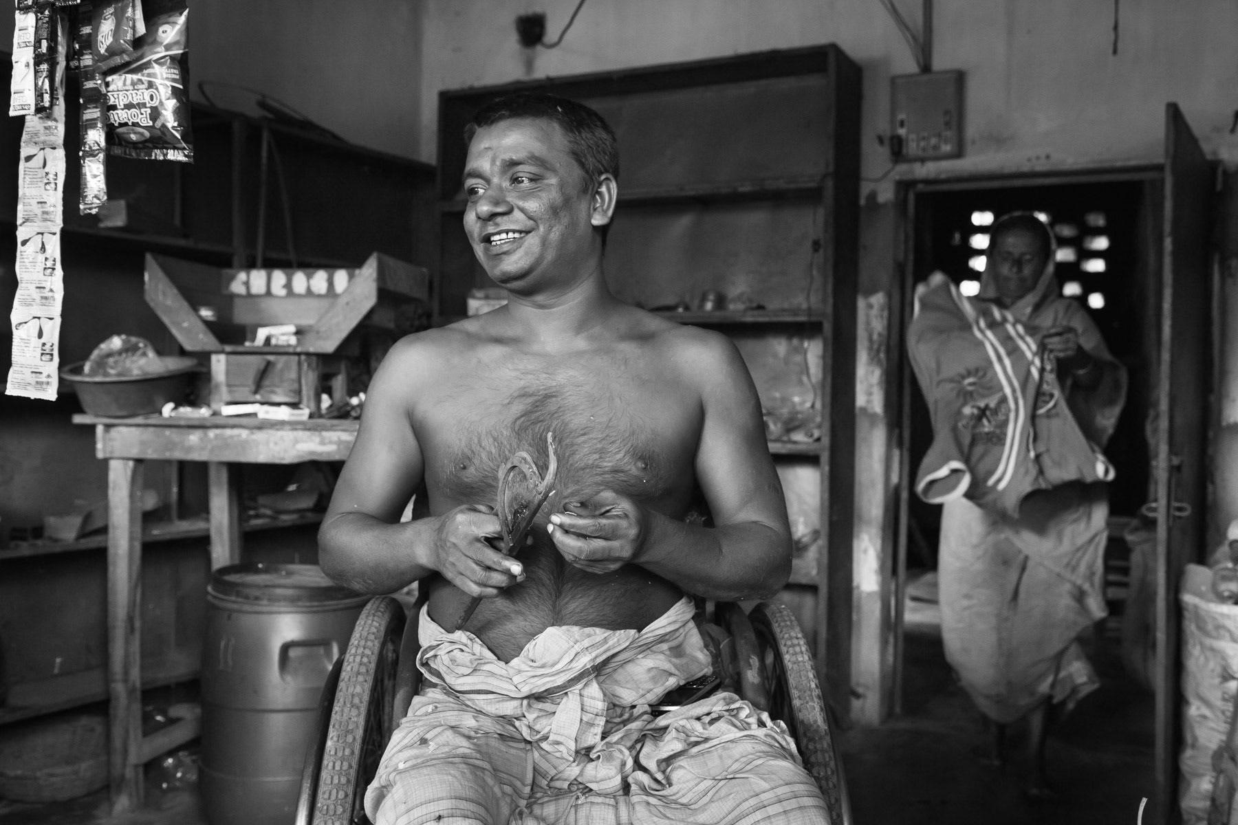 Home visit to a spinal cord injury patient managing a grocery shop donated by CRP, Horipup village near Bogra, Bangladesh, October 2014
